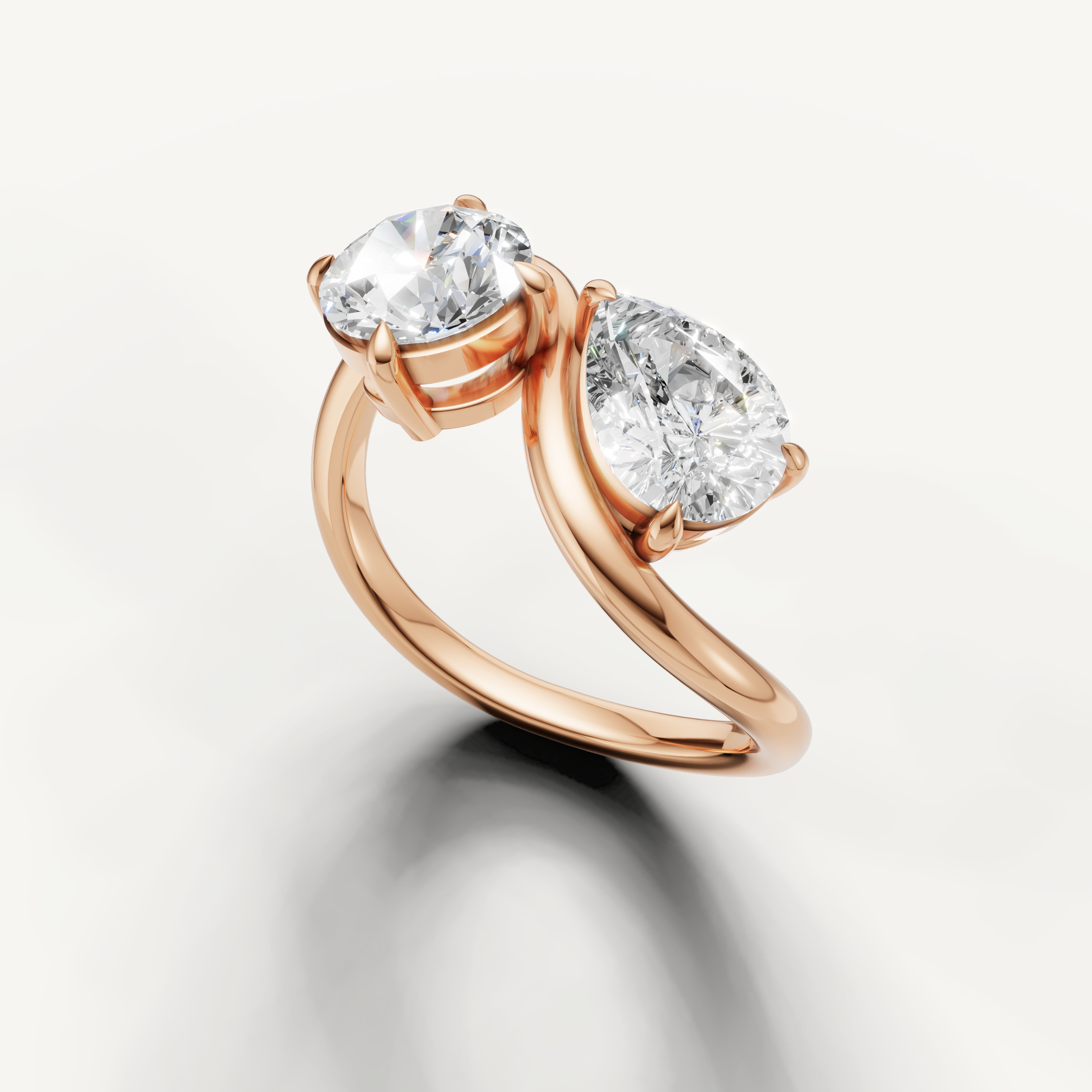 Rose gold toi et moi engagement ring with elegant bypass design by Raul Diamonds
