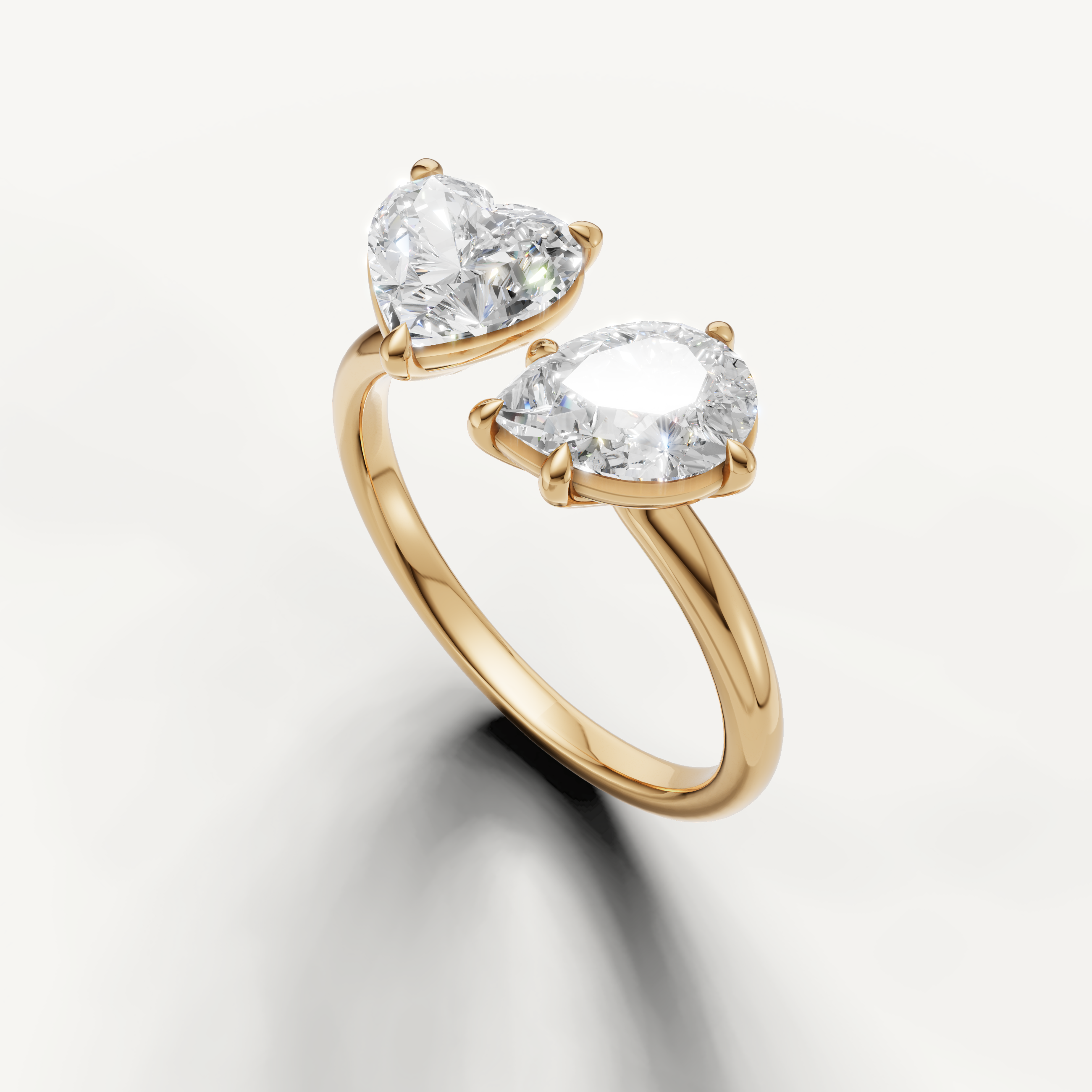 Luxury yellow gold pear and emerald cut engagement ring for women by Raul Diamonds