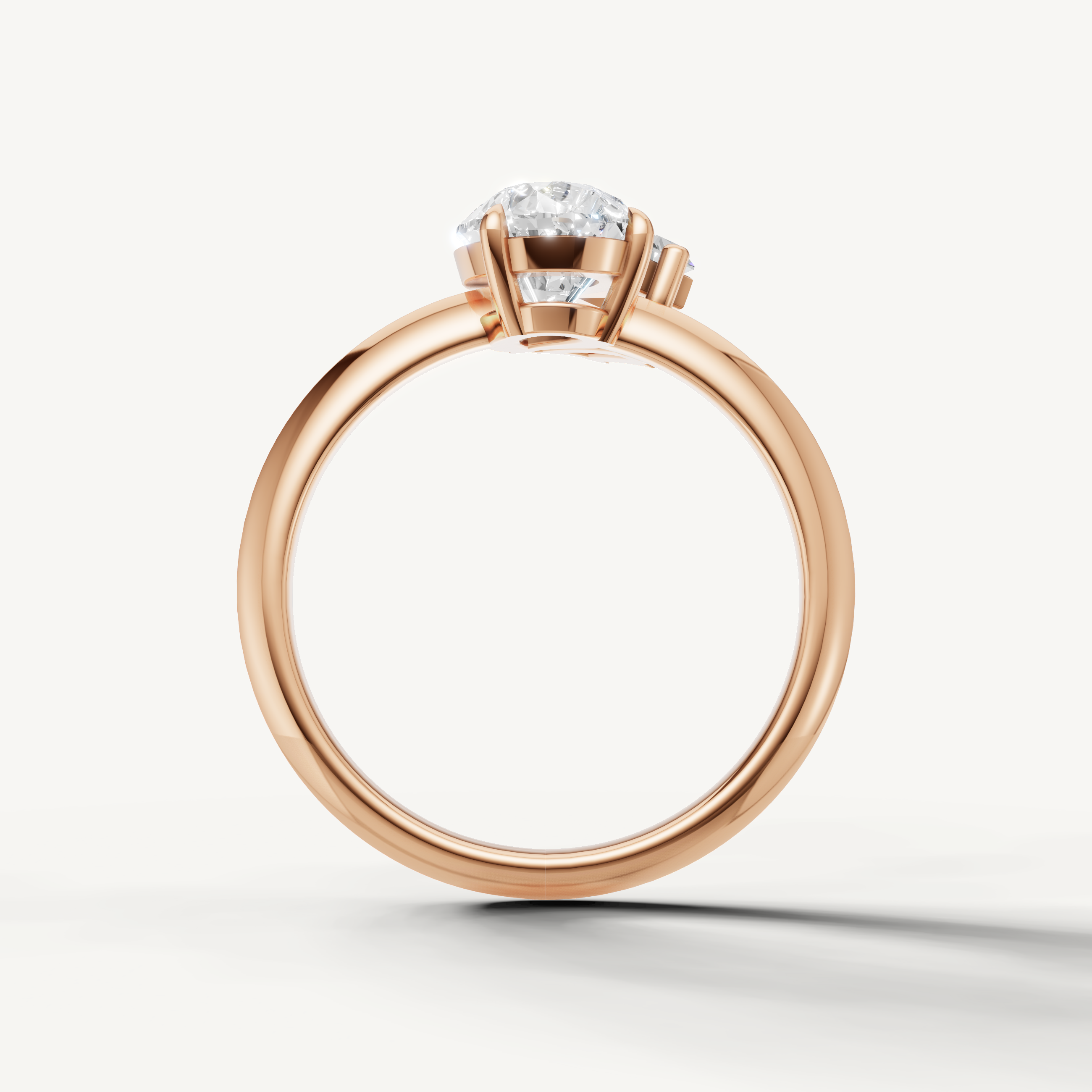 Elegant rose gold toi et moi engagement ring with pear and trapezoid diamonds from Raul Diamonds