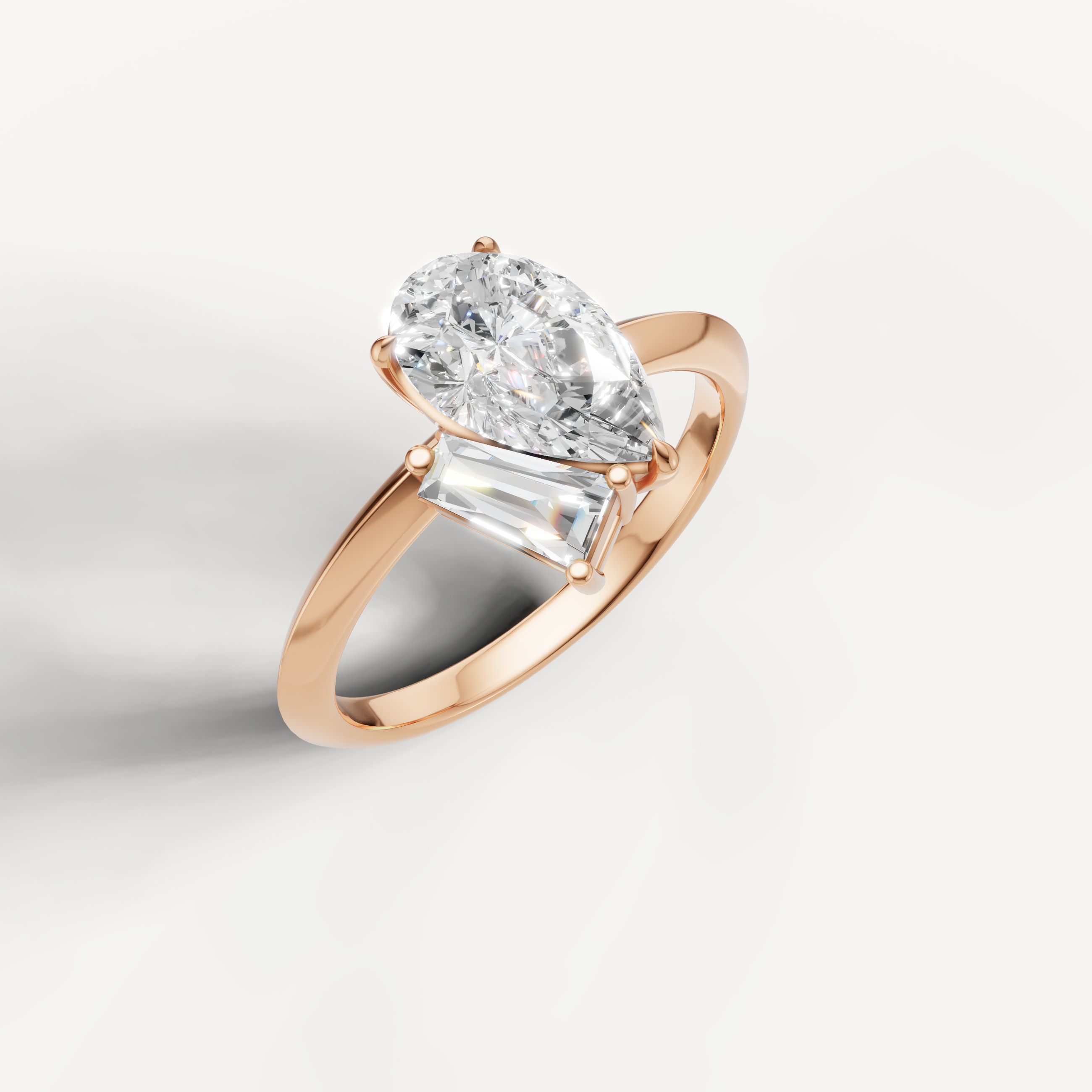 Romantic rose gold pear and trapezoid diamond engagement ring by Raul Diamonds