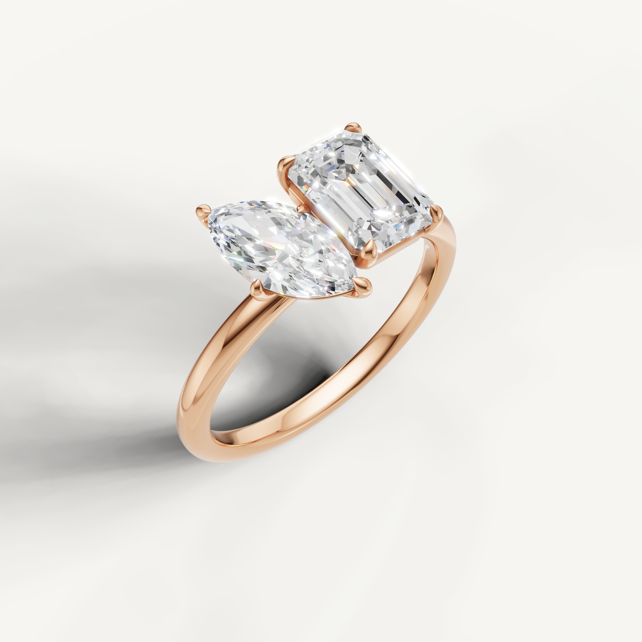 Luxury rose gold dual stone diamond ring with marquise and emerald lab diamonds from Raul Diamonds