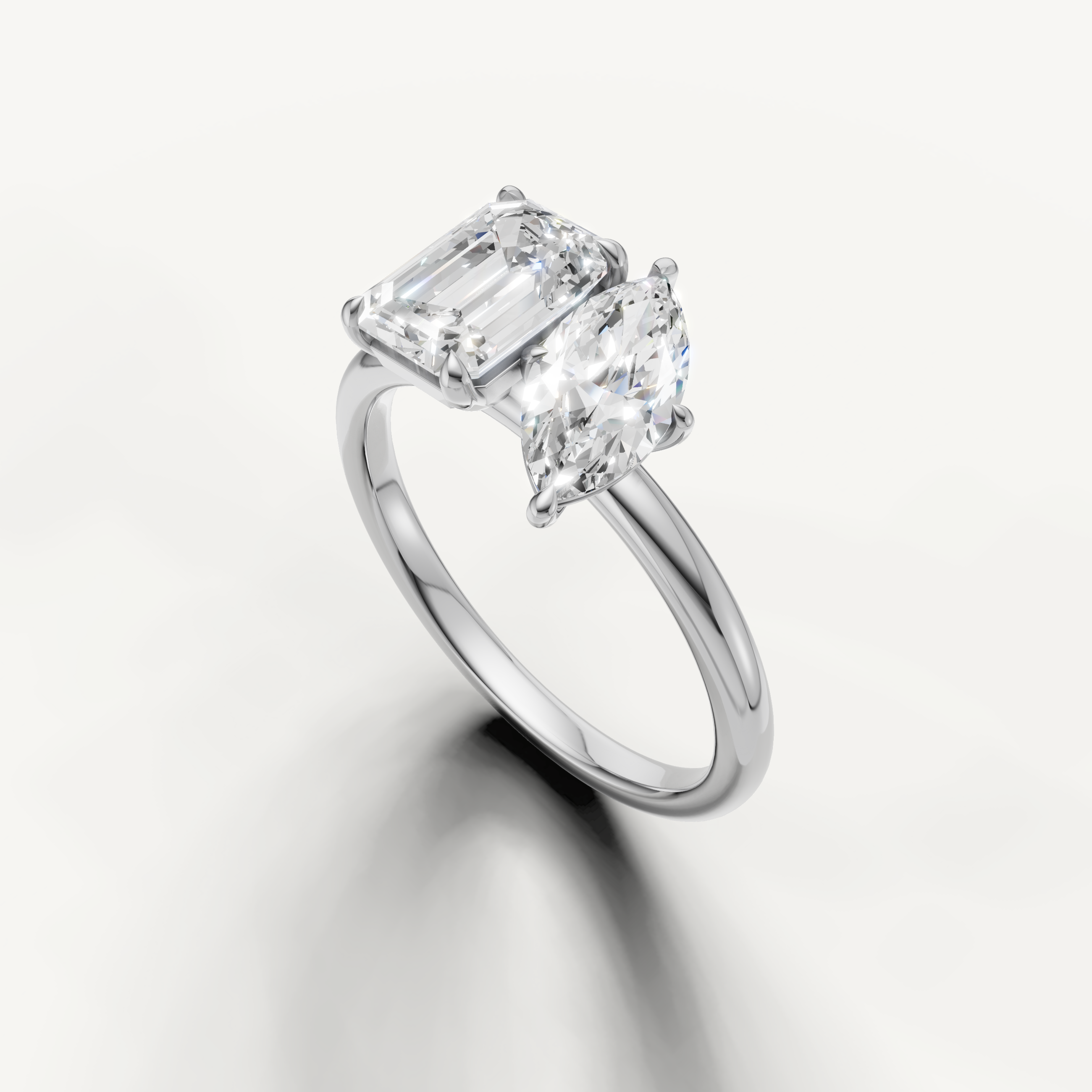 Luxury white gold dual stone engagement ring with marquise and emerald diamonds from Raul Diamonds