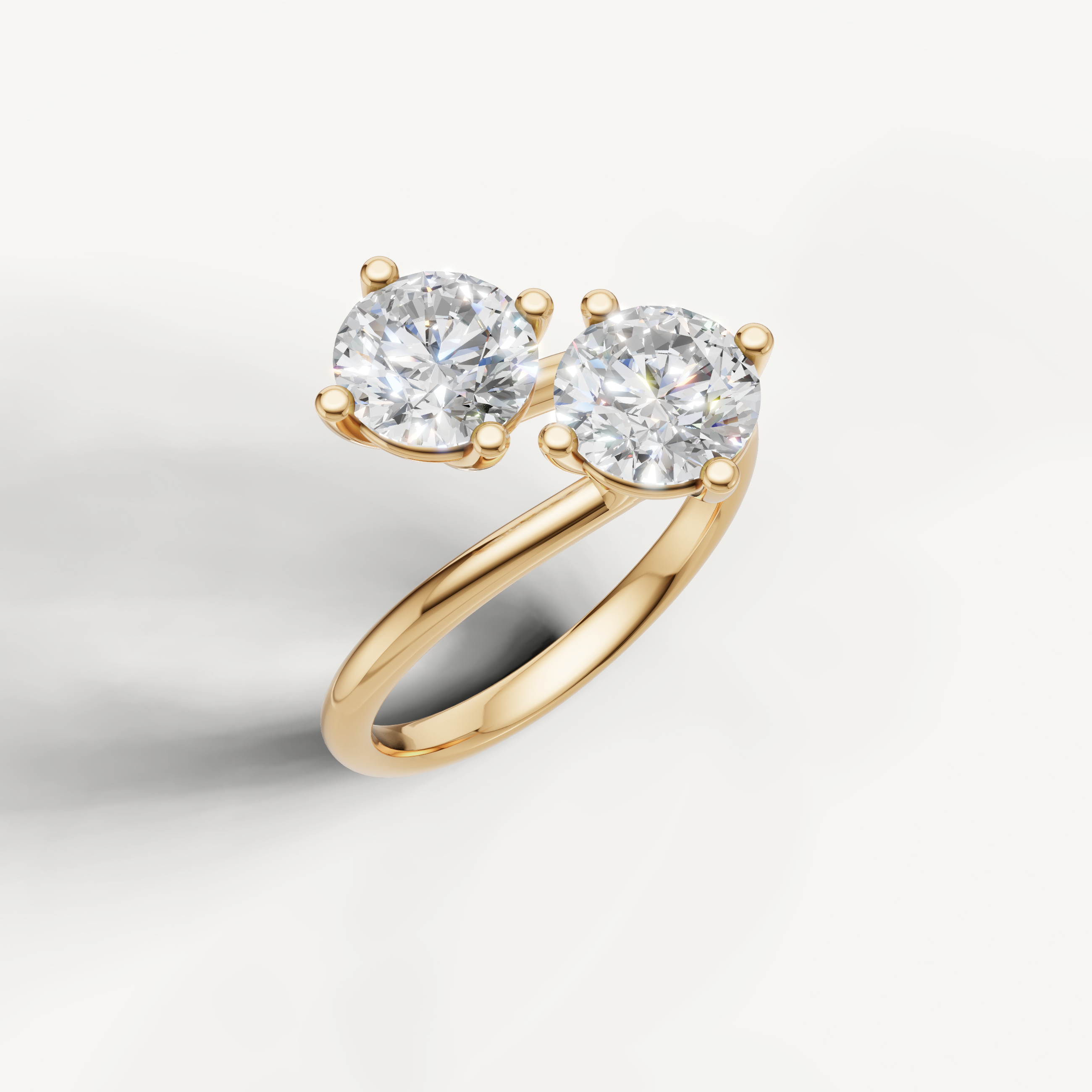 Elegant yellow gold double round diamond ring by Raul Diamonds with modern bypass design