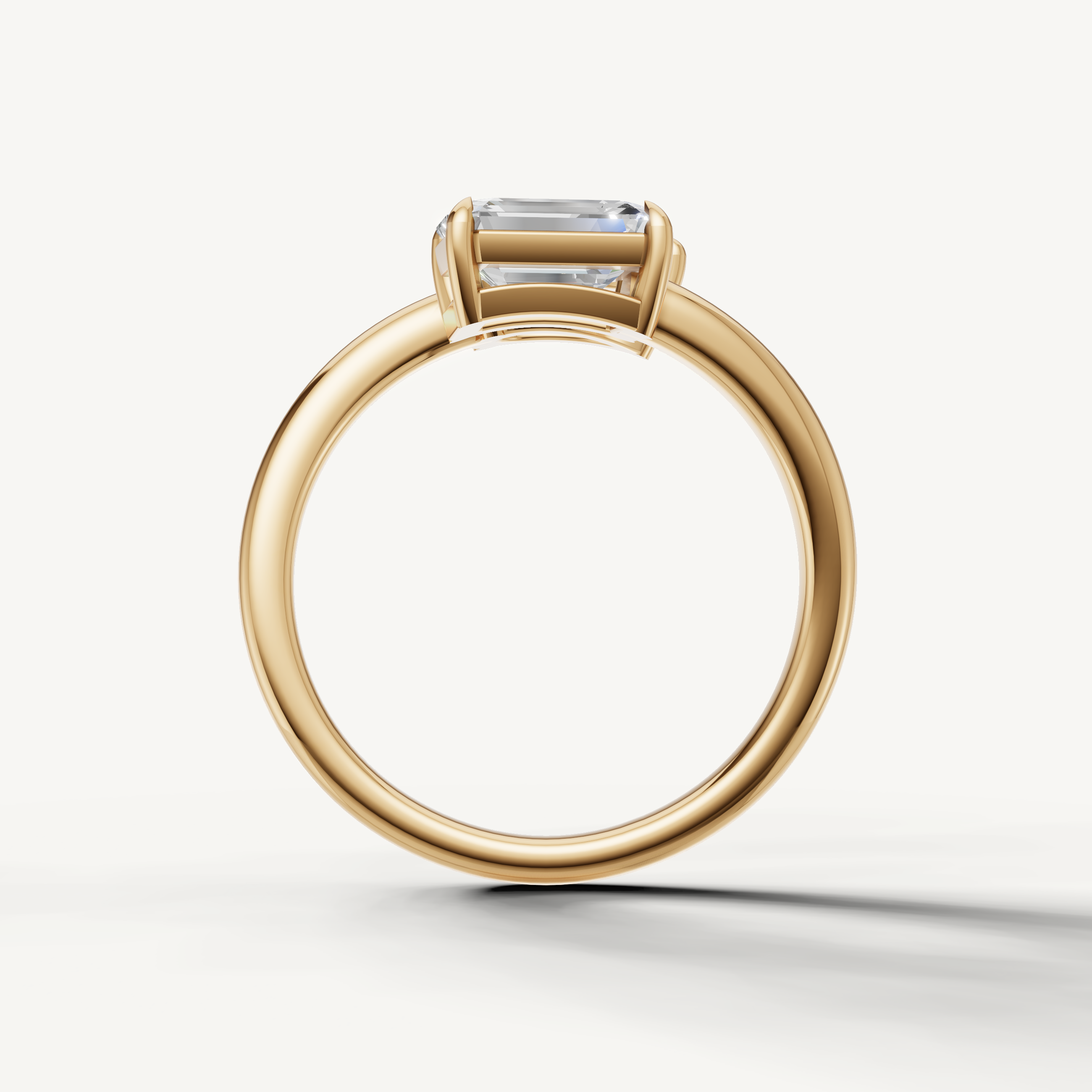 Elegant yellow gold bypass ring with pear cut and emerald cut diamond design from Raul Diamonds