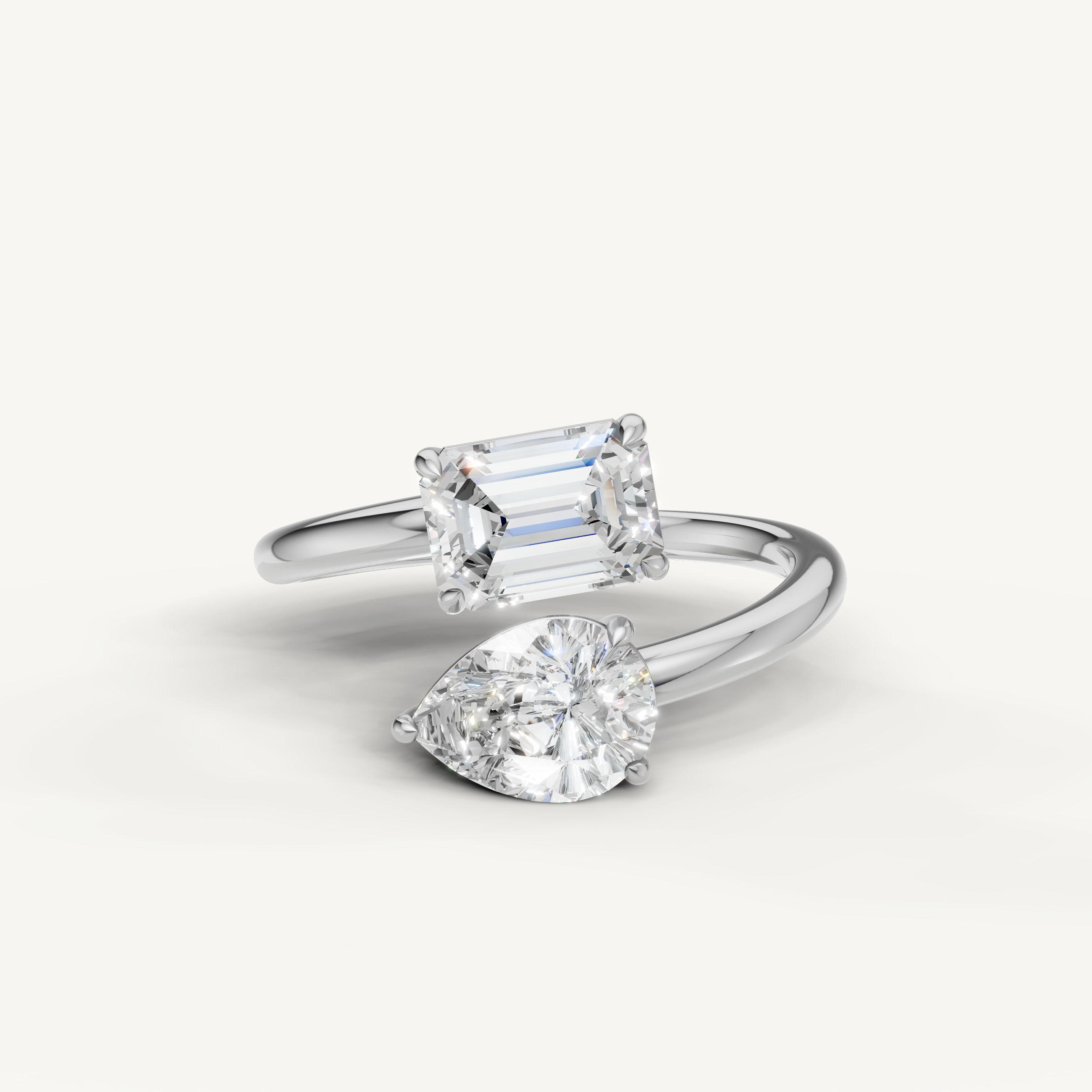 Raul Diamonds white gold bypass engagement ring with pear and emerald cut lab grown diamonds