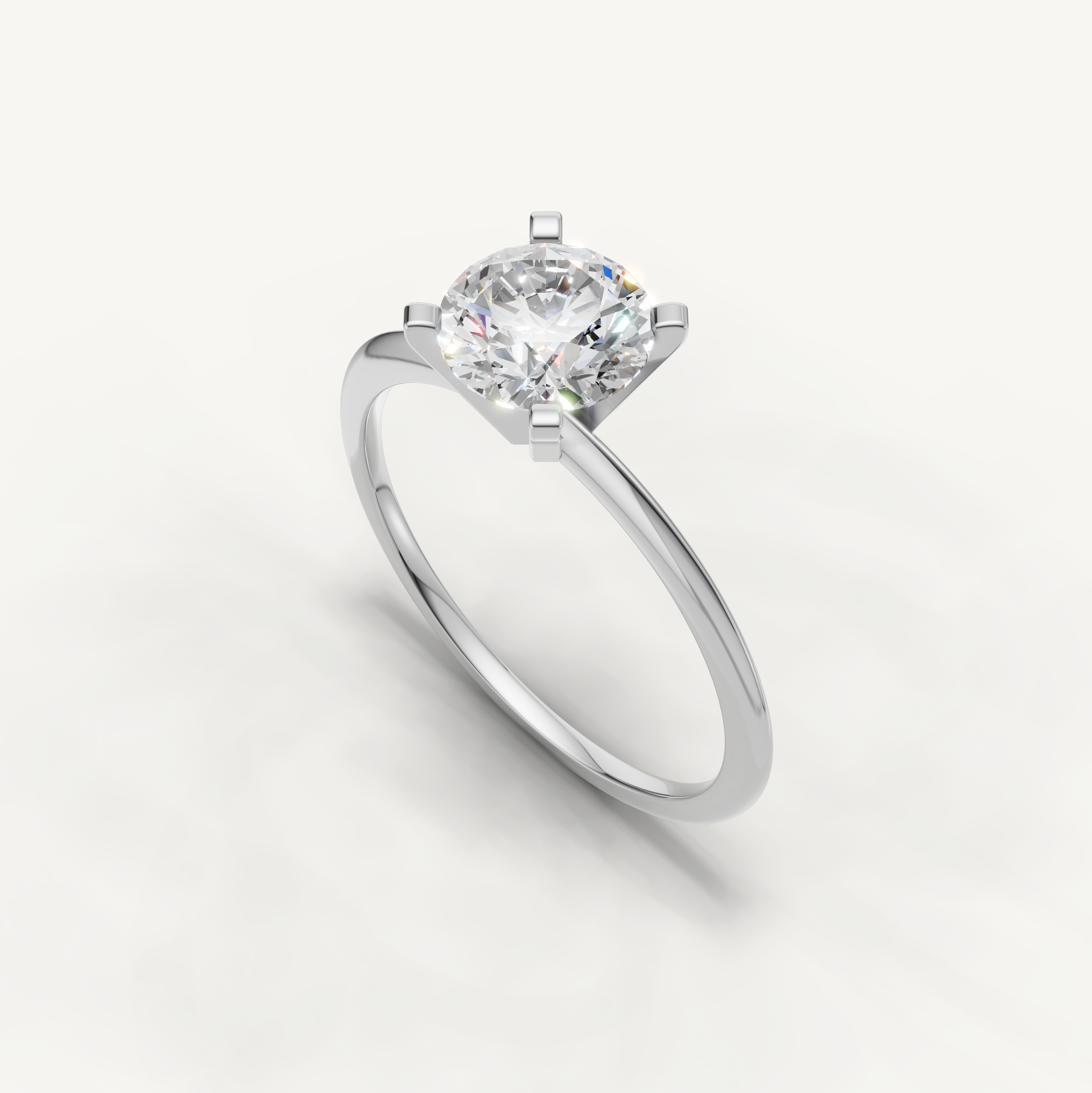 Elegant white gold round cut engagement ring for women by Raul Diamonds
