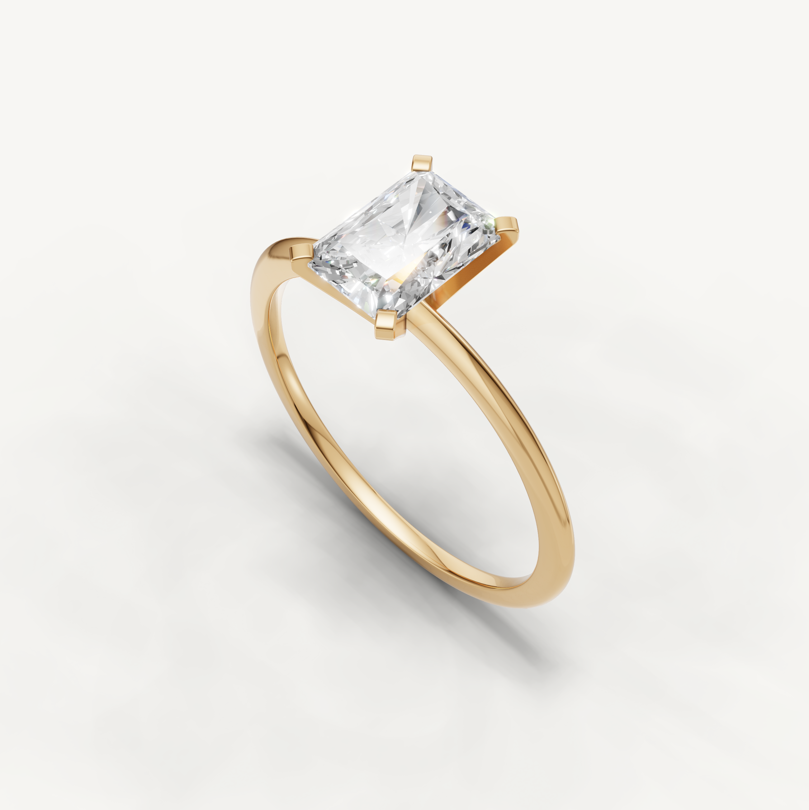 Modern radiant cut diamond engagement ring in polished yellow gold by Raul Diamonds