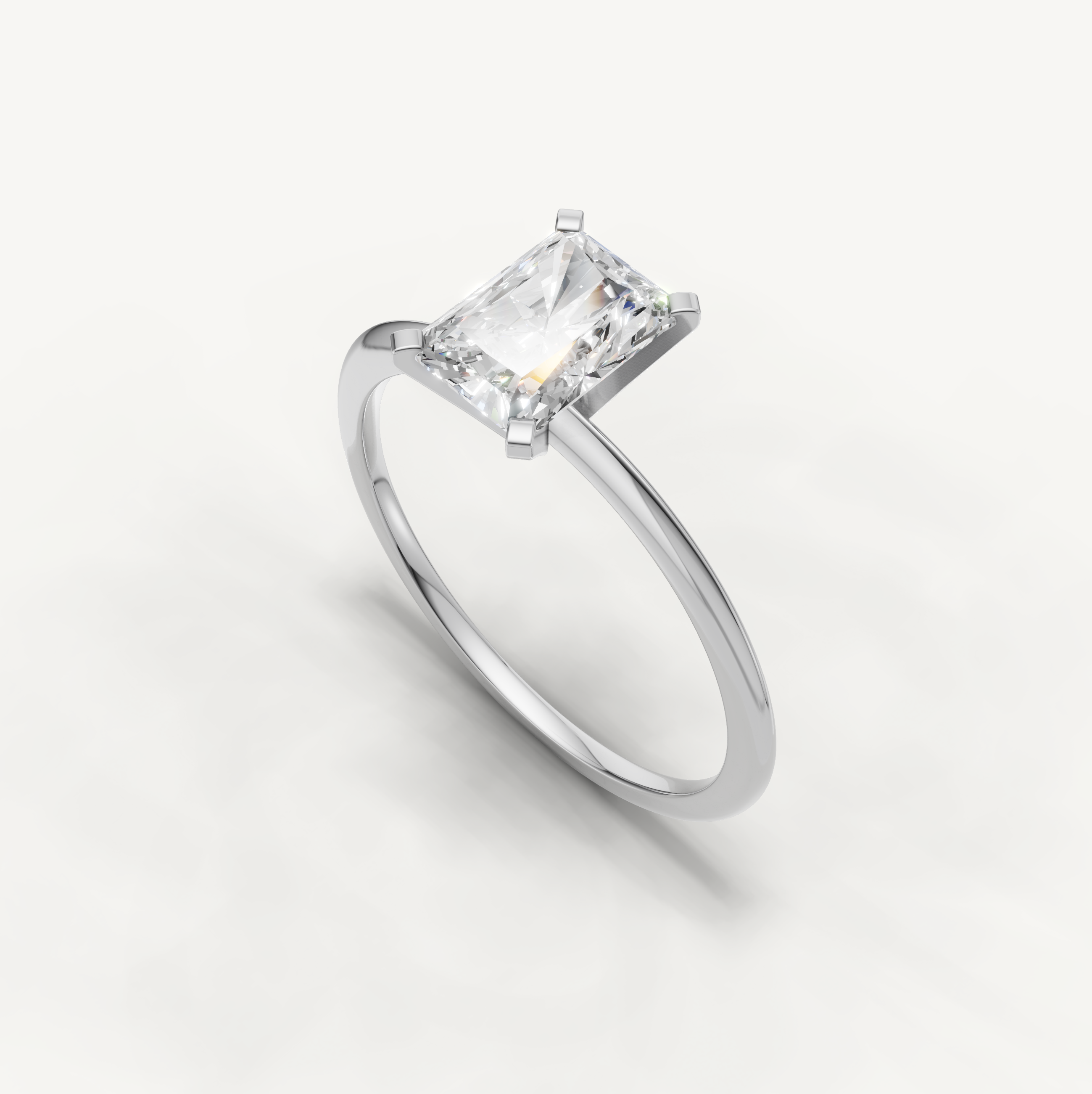 Elegant white gold radiant cut engagement ring for women by Raul Diamonds
