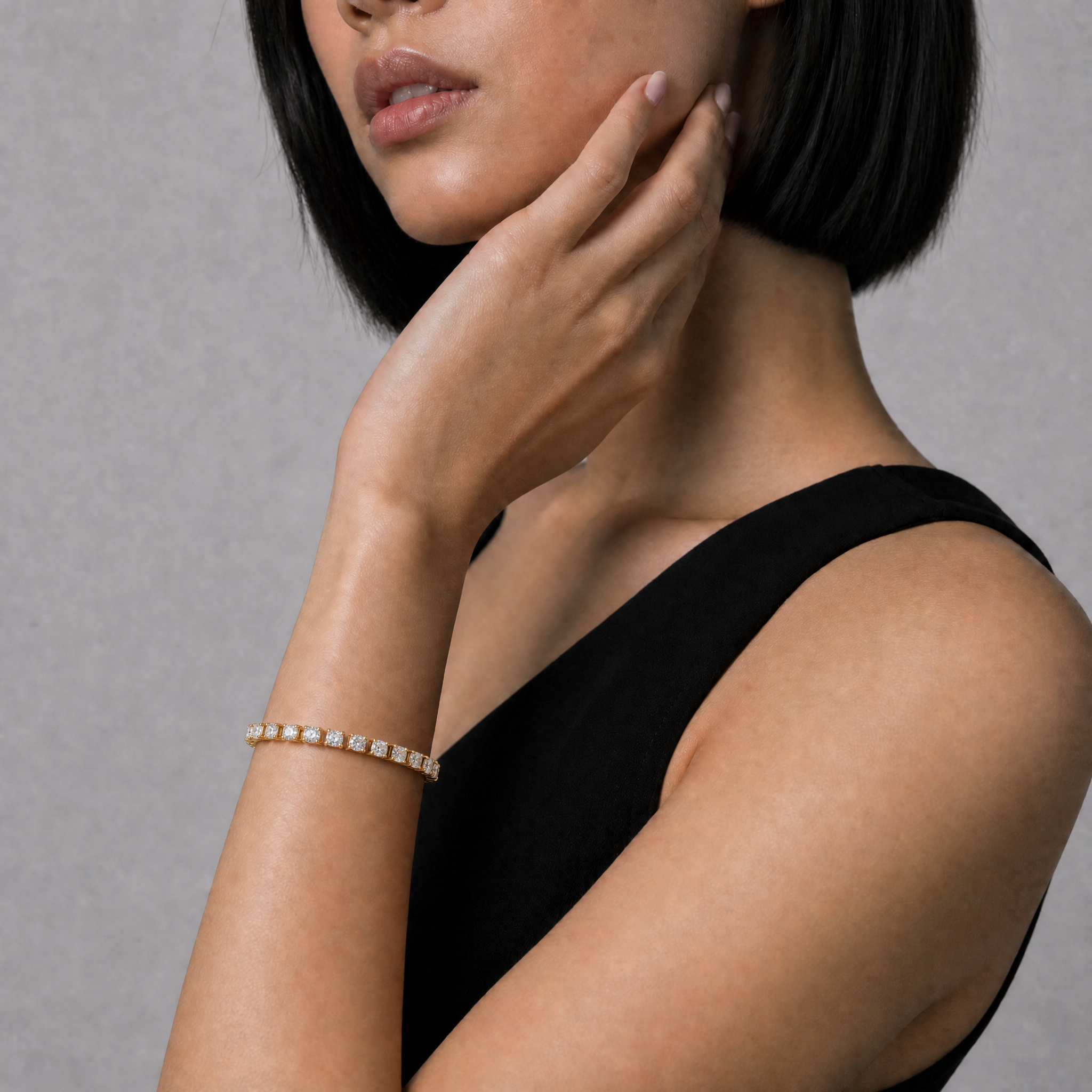 Model wearing Raul Diamonds yellow gold round lab grown diamond tennis bracelet with classic four prong setting and brilliant cut diamonds