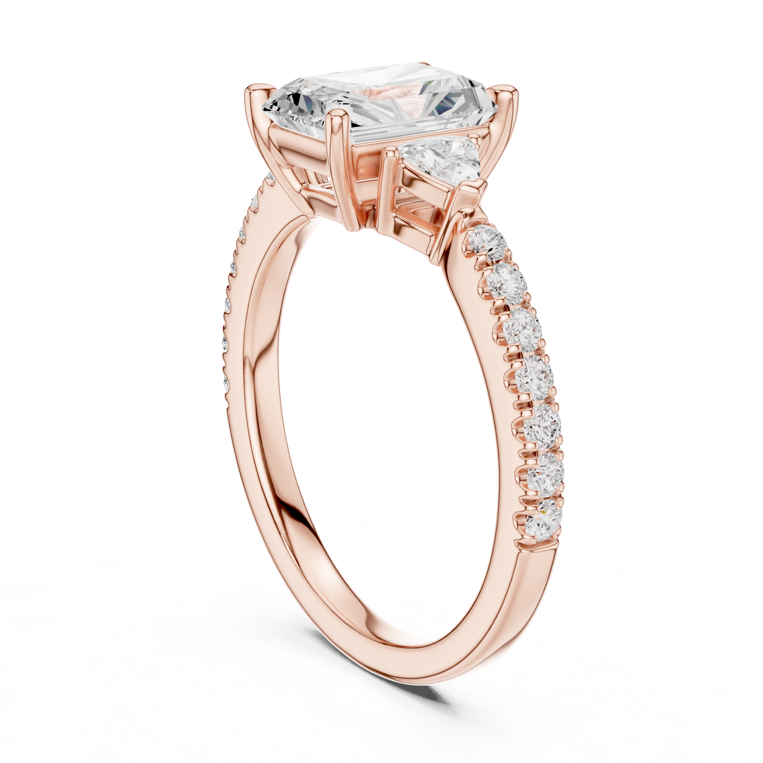 Engagement ring featuring radiant cut lab diamond and trillion side stones