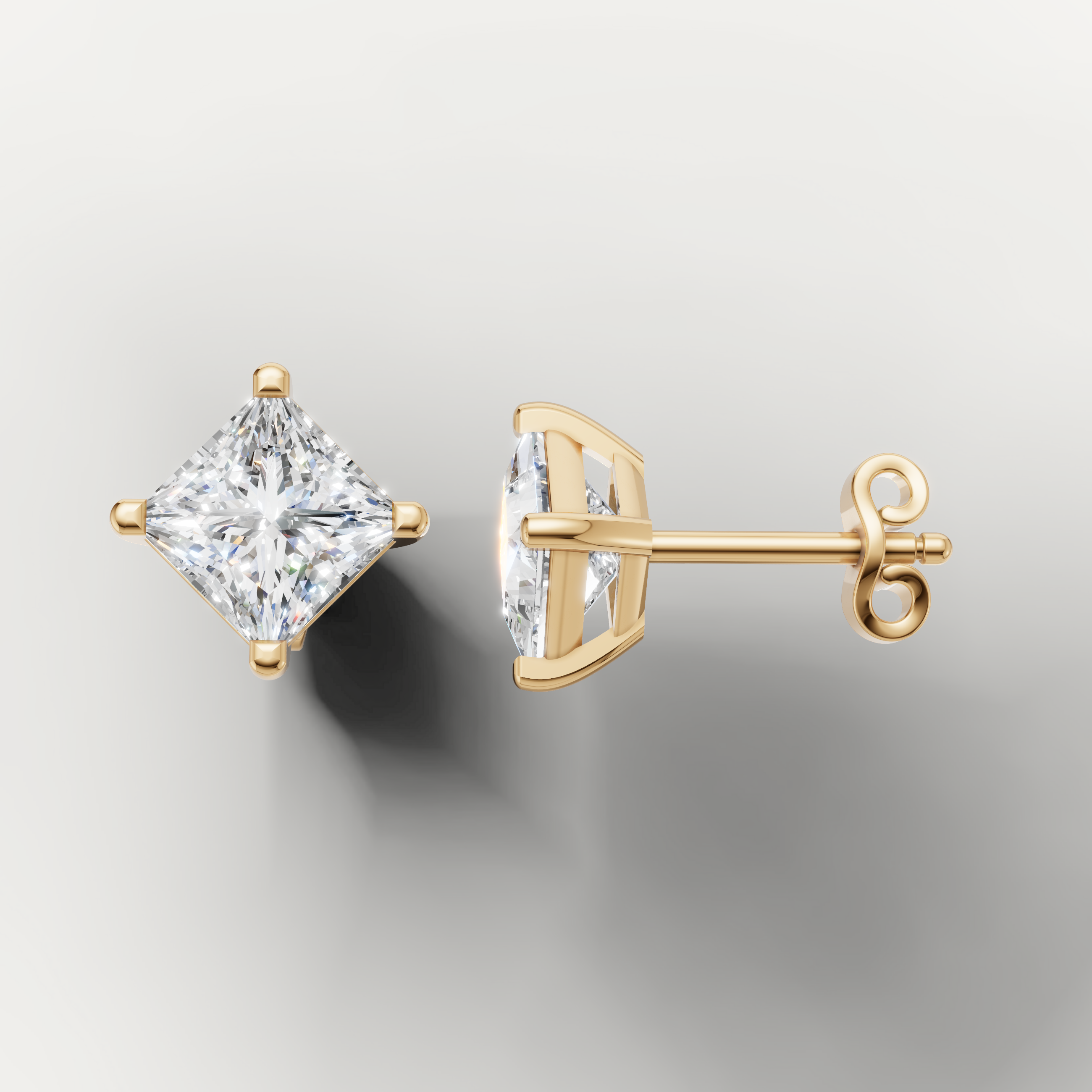 Yellow gold solitaire princess diamond earrings by Raul Diamonds with brilliant sparkle