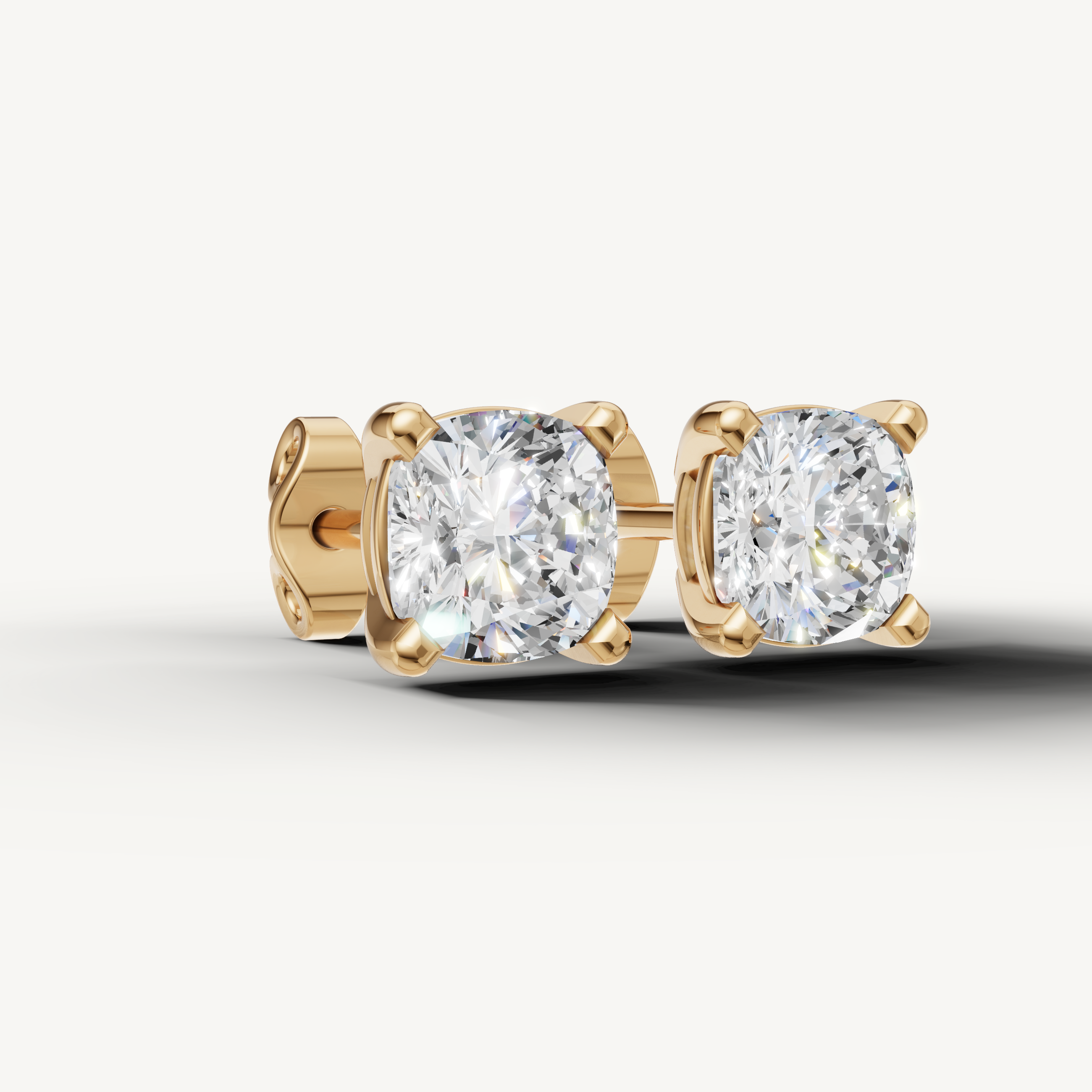 Raul Diamonds yellow gold cushion cut diamond stud earrings for modern luxury style