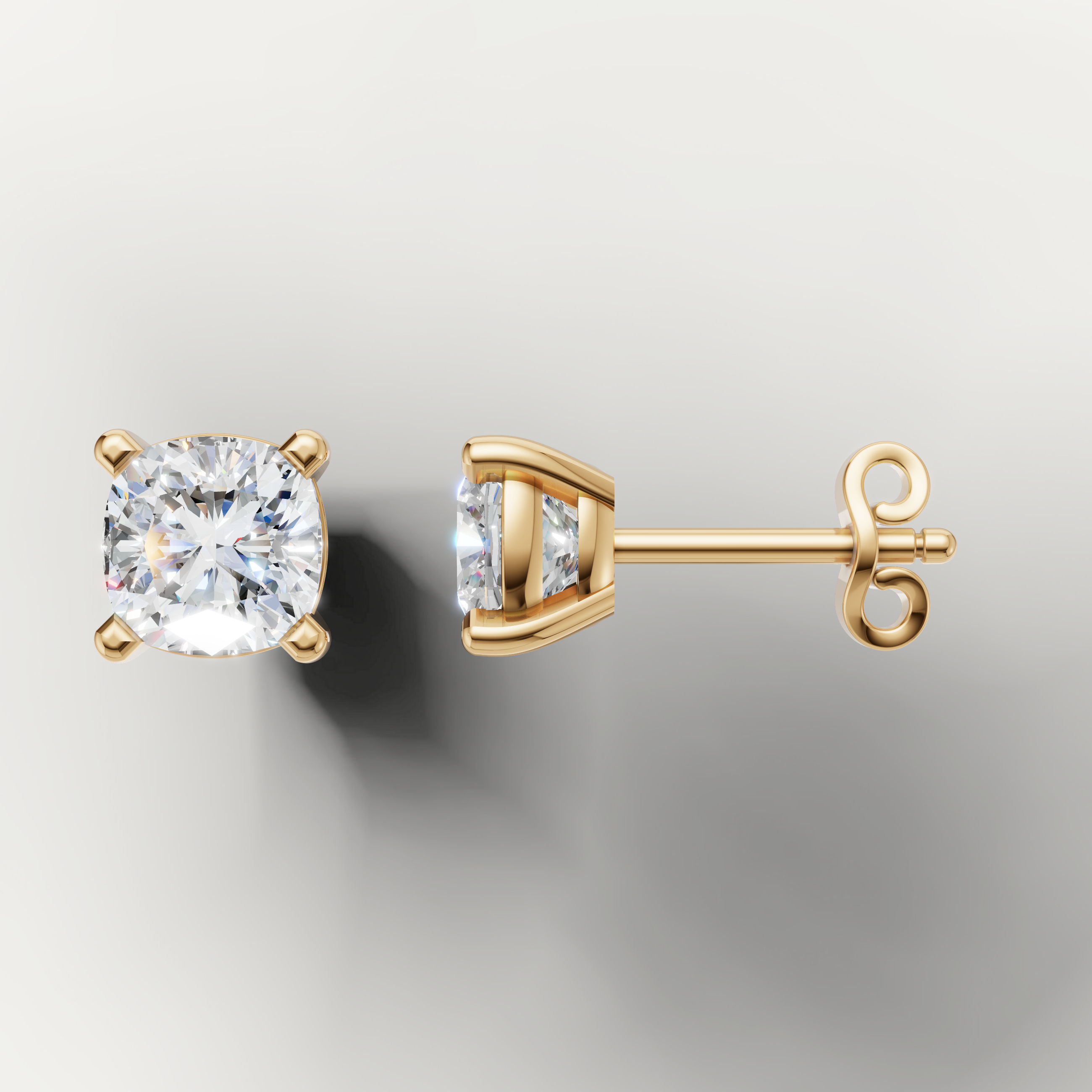 Yellow gold solitaire cushion diamond earrings by Raul Diamonds with elegant brilliance