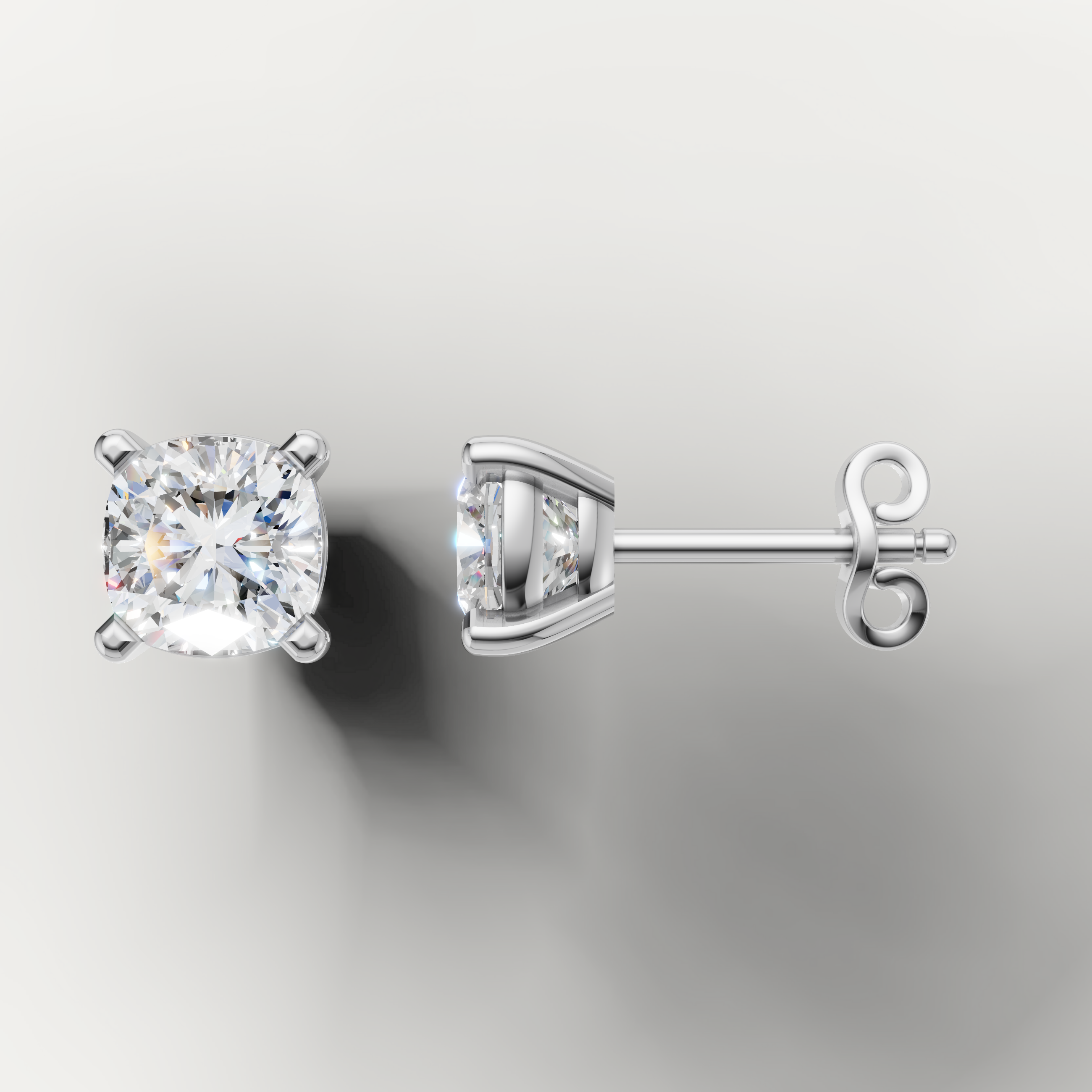 White gold solitaire cushion diamond earrings by Raul Diamonds with elegant sparkle