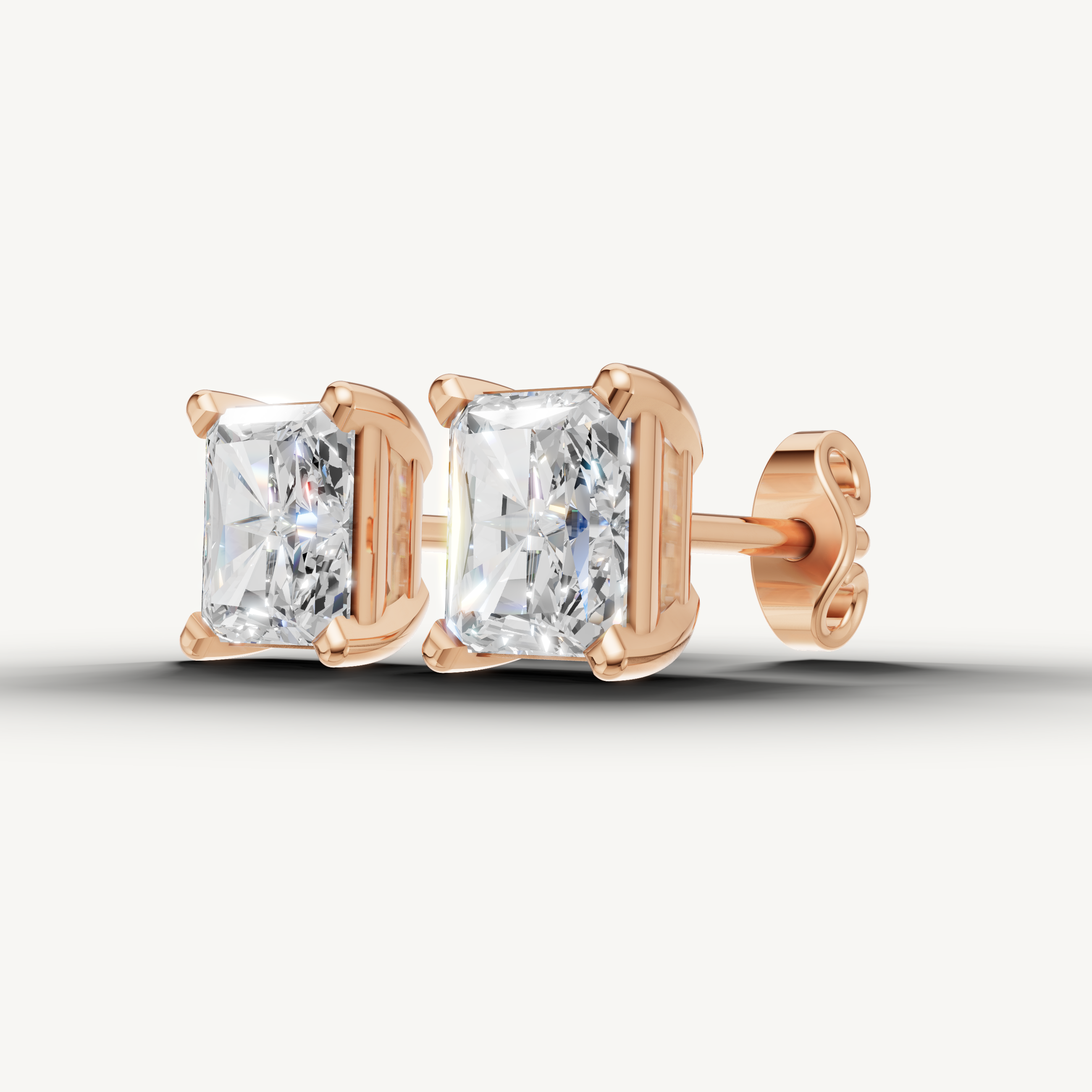 Elegant rose gold radiant diamond stud earrings with dazzling brilliance by Raul Diamonds
