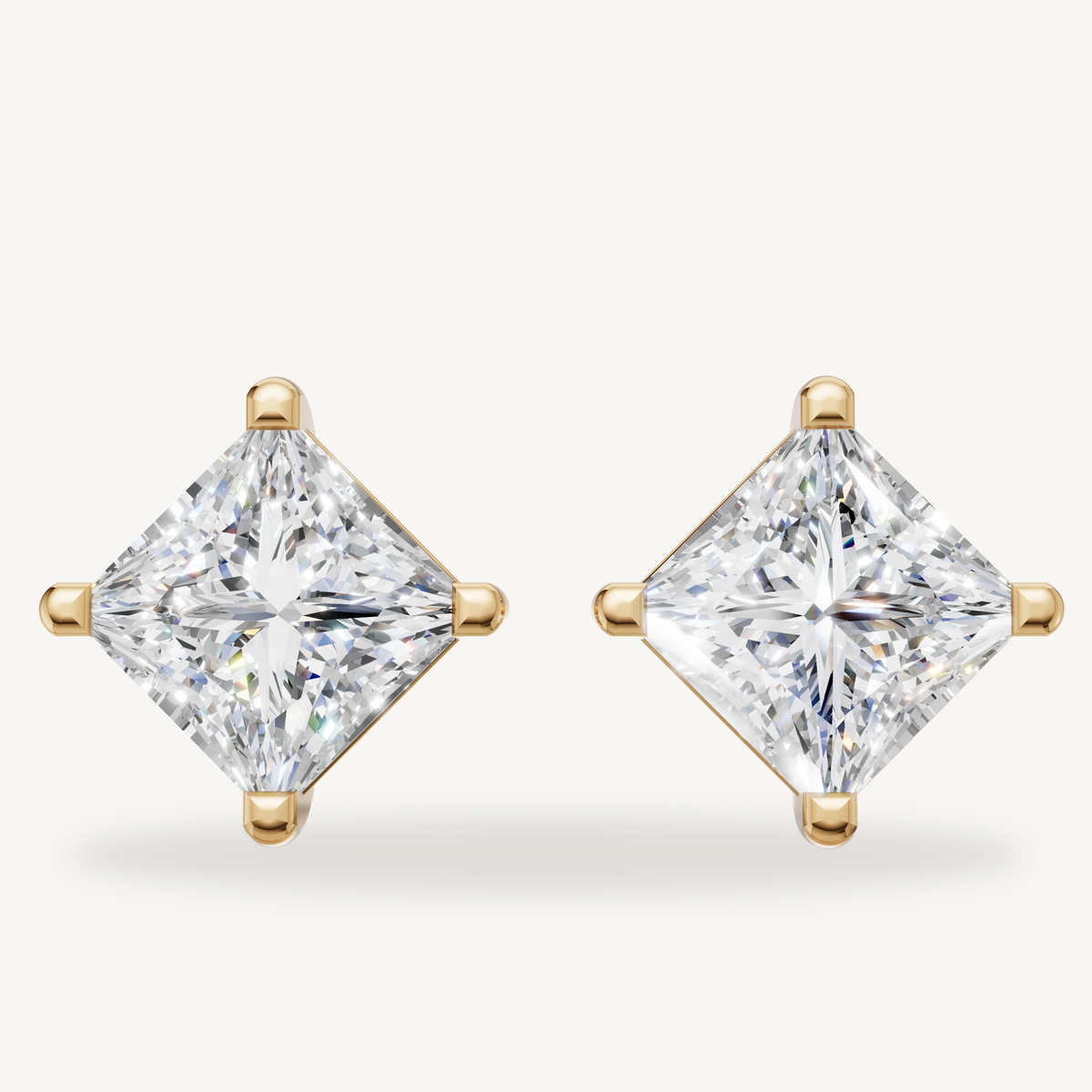 Princess cut lab grown diamond stud earrings in 14K yellow gold by Raul Diamonds