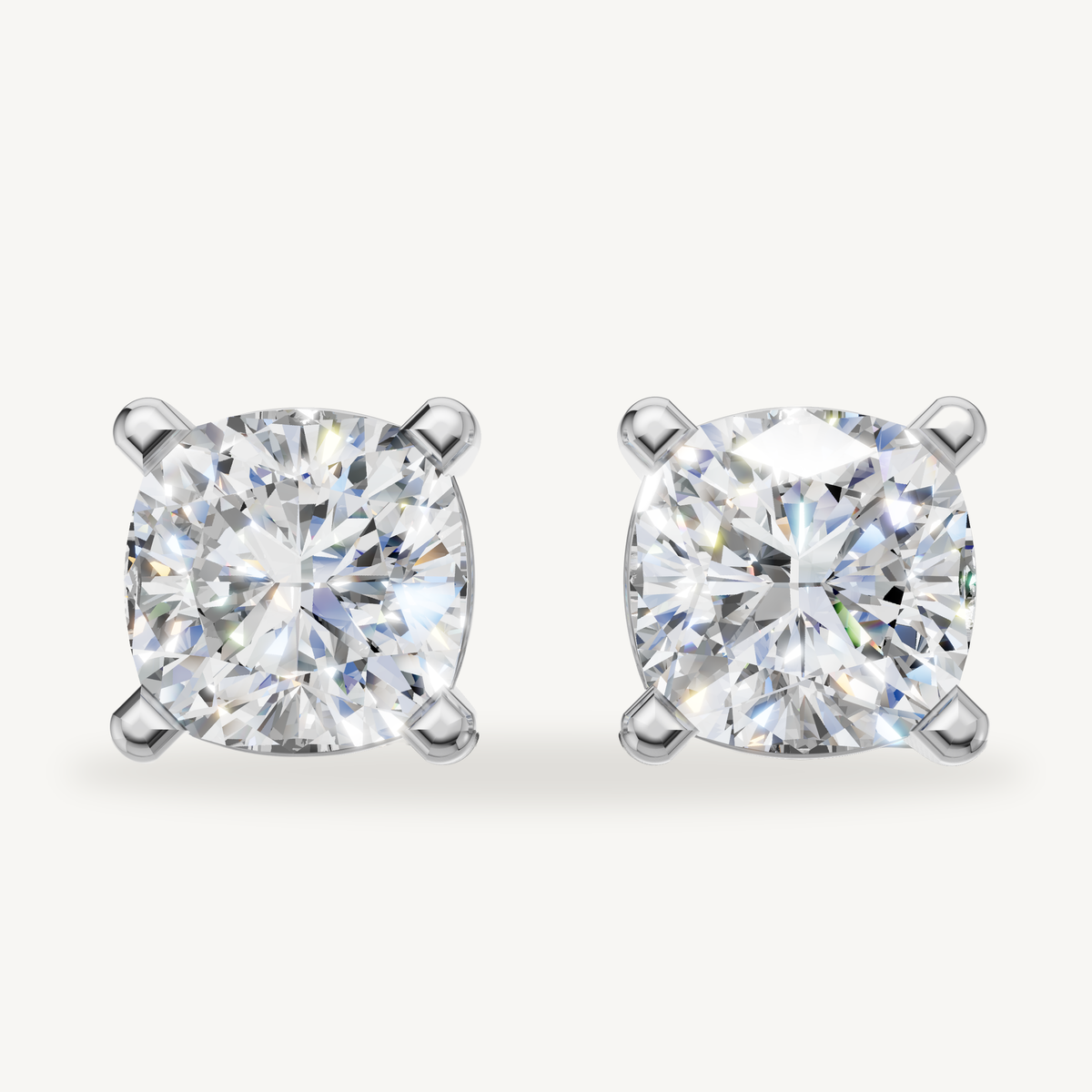 Cushion cut lab grown diamond stud earrings in 14K white gold by Raul Diamonds