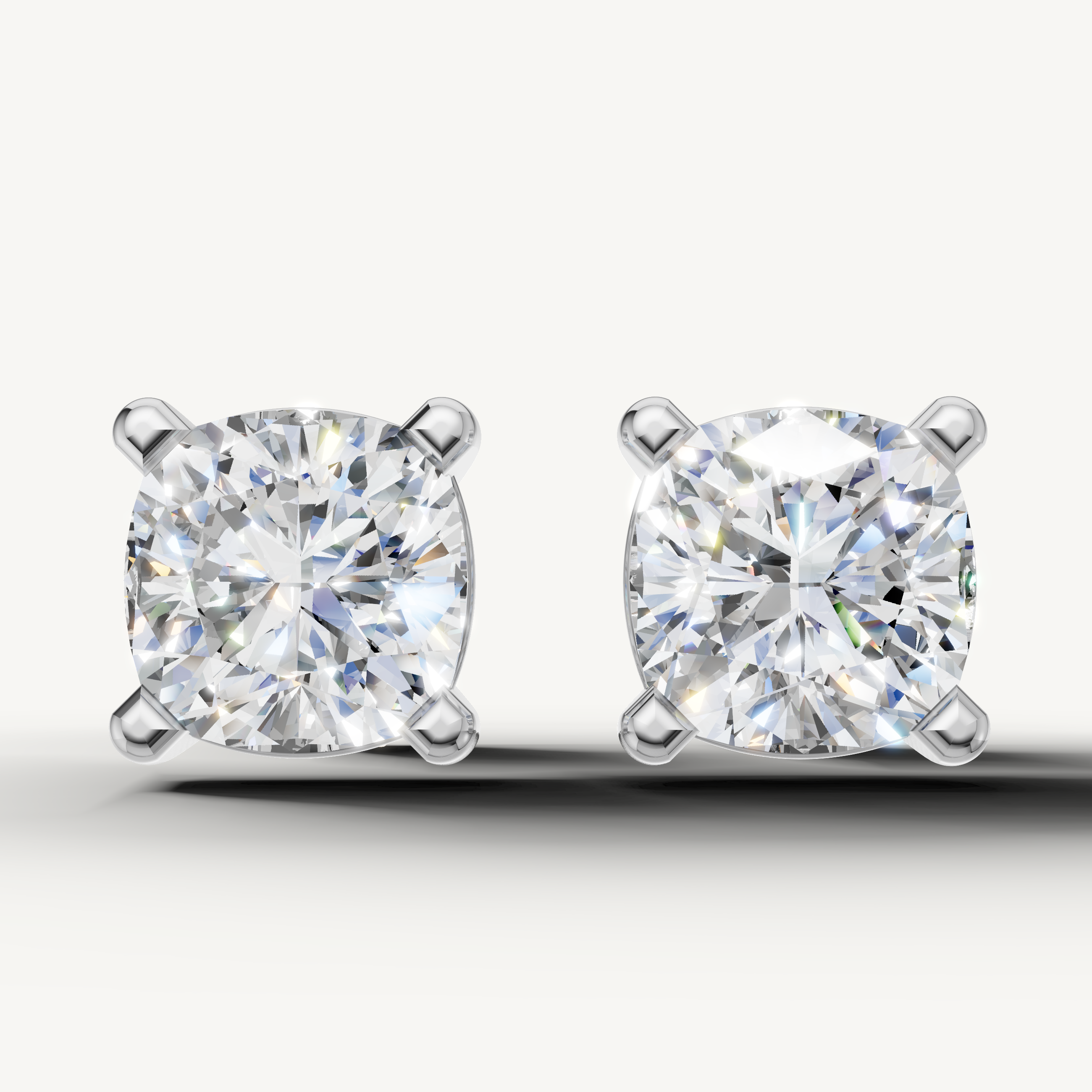 Cushion cut lab grown diamond stud earrings in 14K white gold by Raul Diamonds