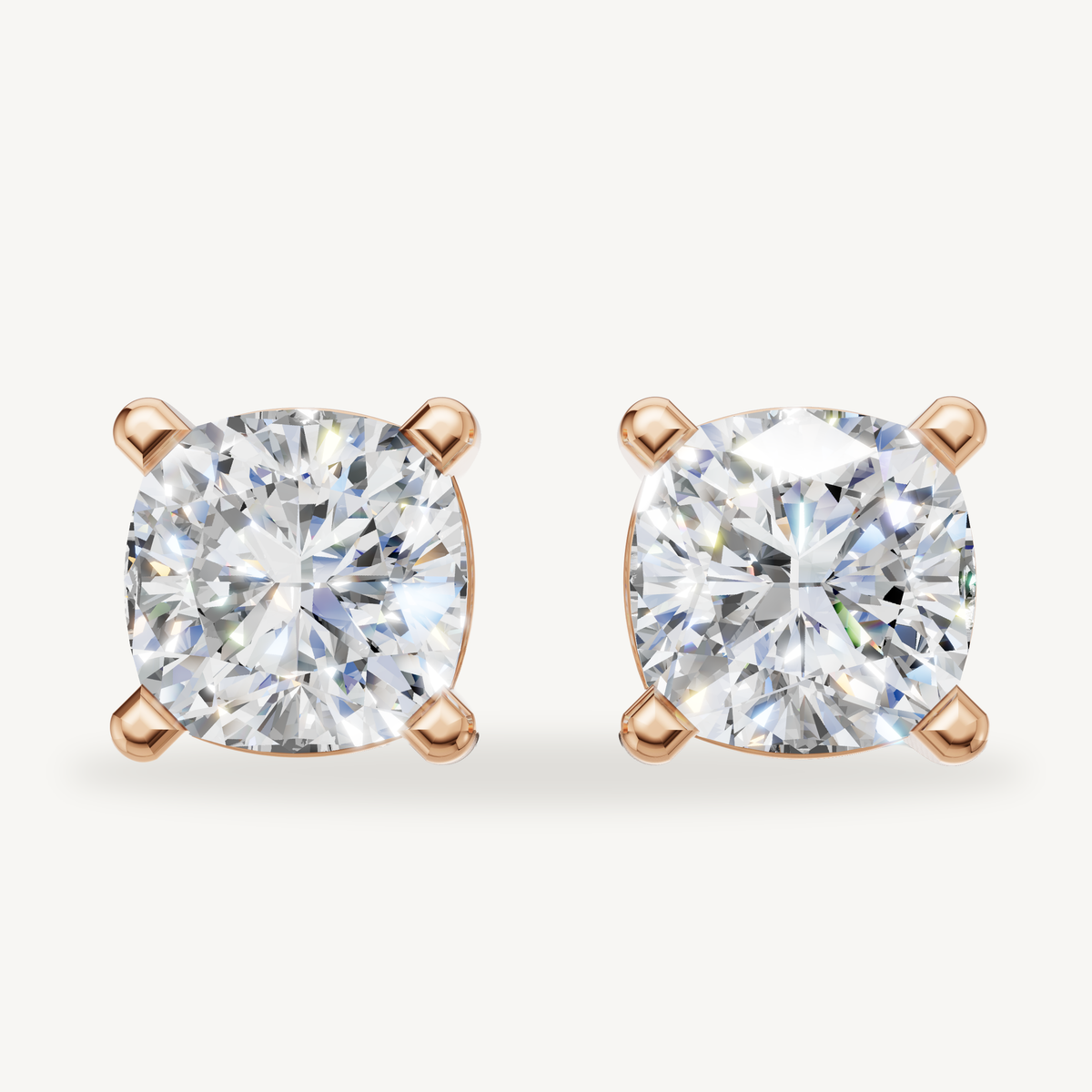 Cushion cut lab grown diamond stud earrings in 14K rose gold by Raul Diamonds