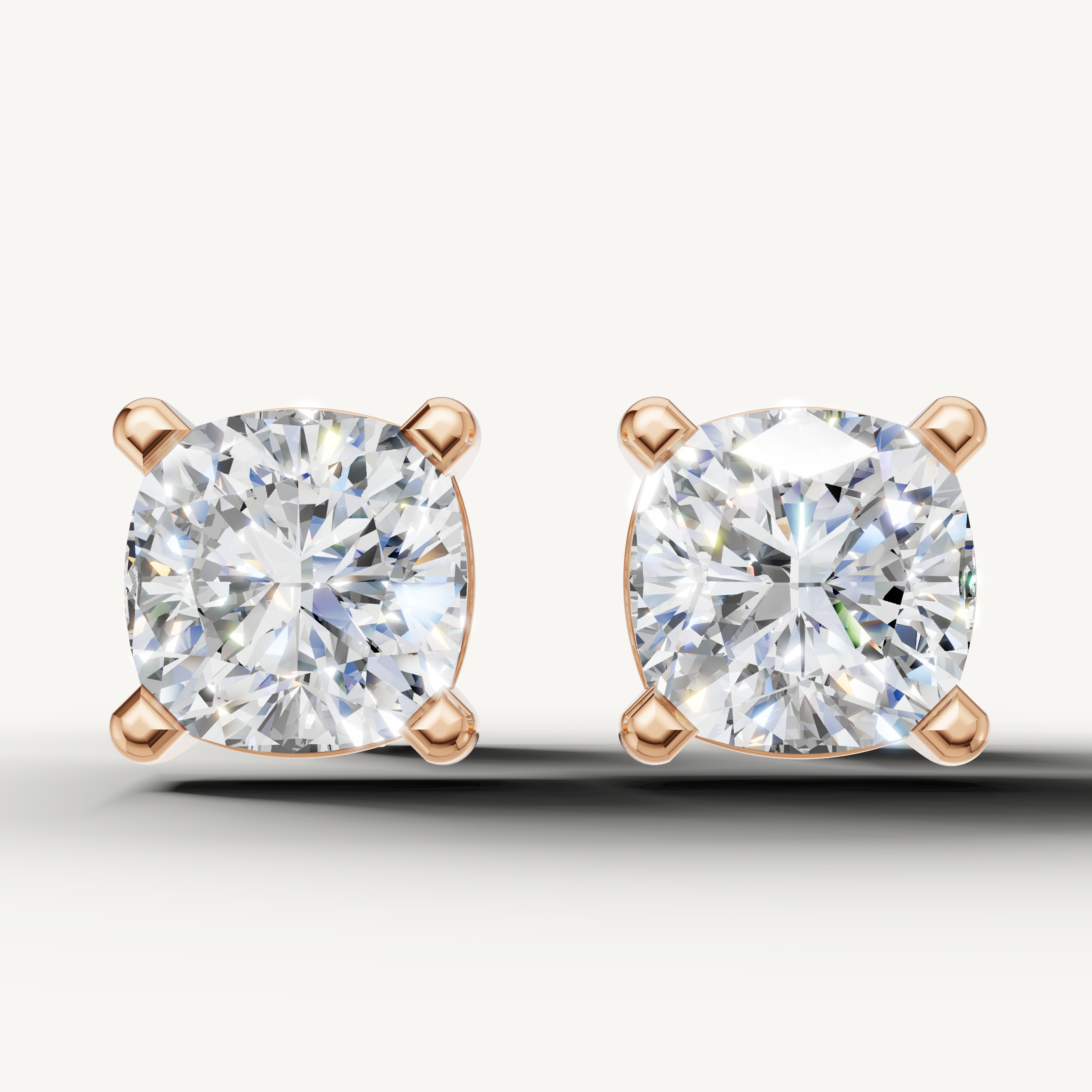 Cushion cut lab grown diamond stud earrings in 14K rose gold by Raul Diamonds