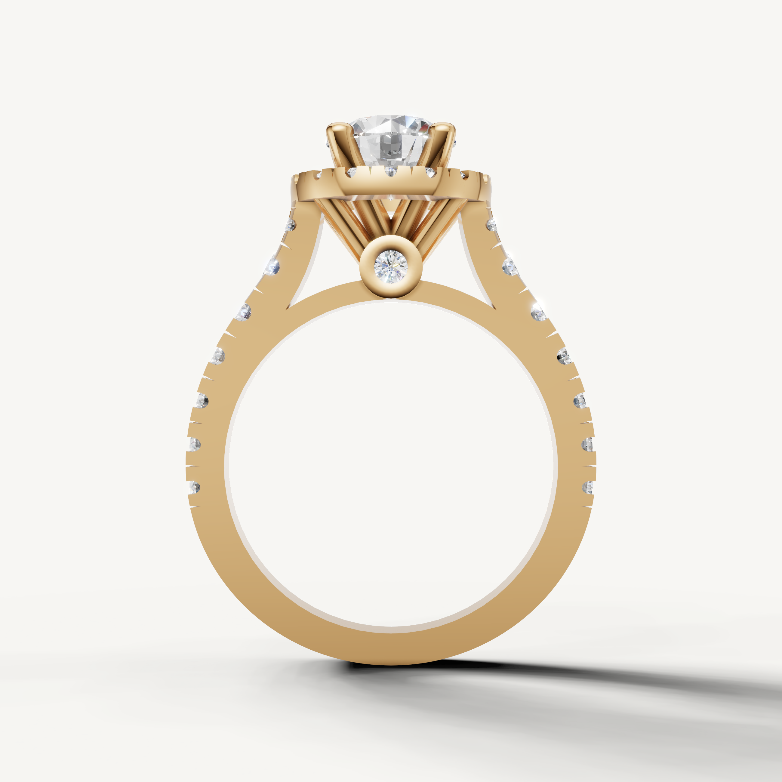 Close-up of Seo yellow gold halo ring with round brilliant center stone by Raul Diamonds.