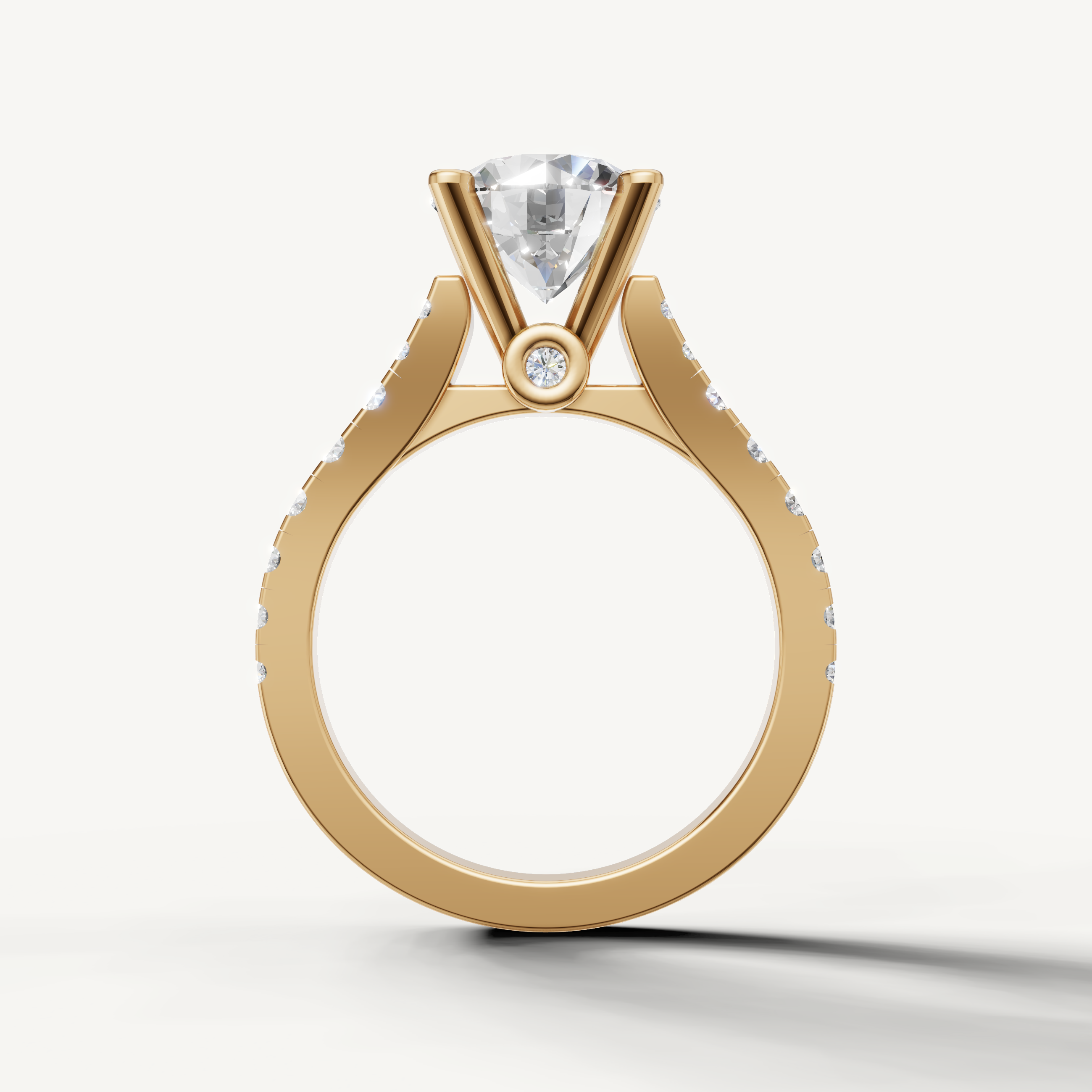 Close-up of Seo yellow gold round solitaire ring with sparkling side diamonds by Raul Diamonds.