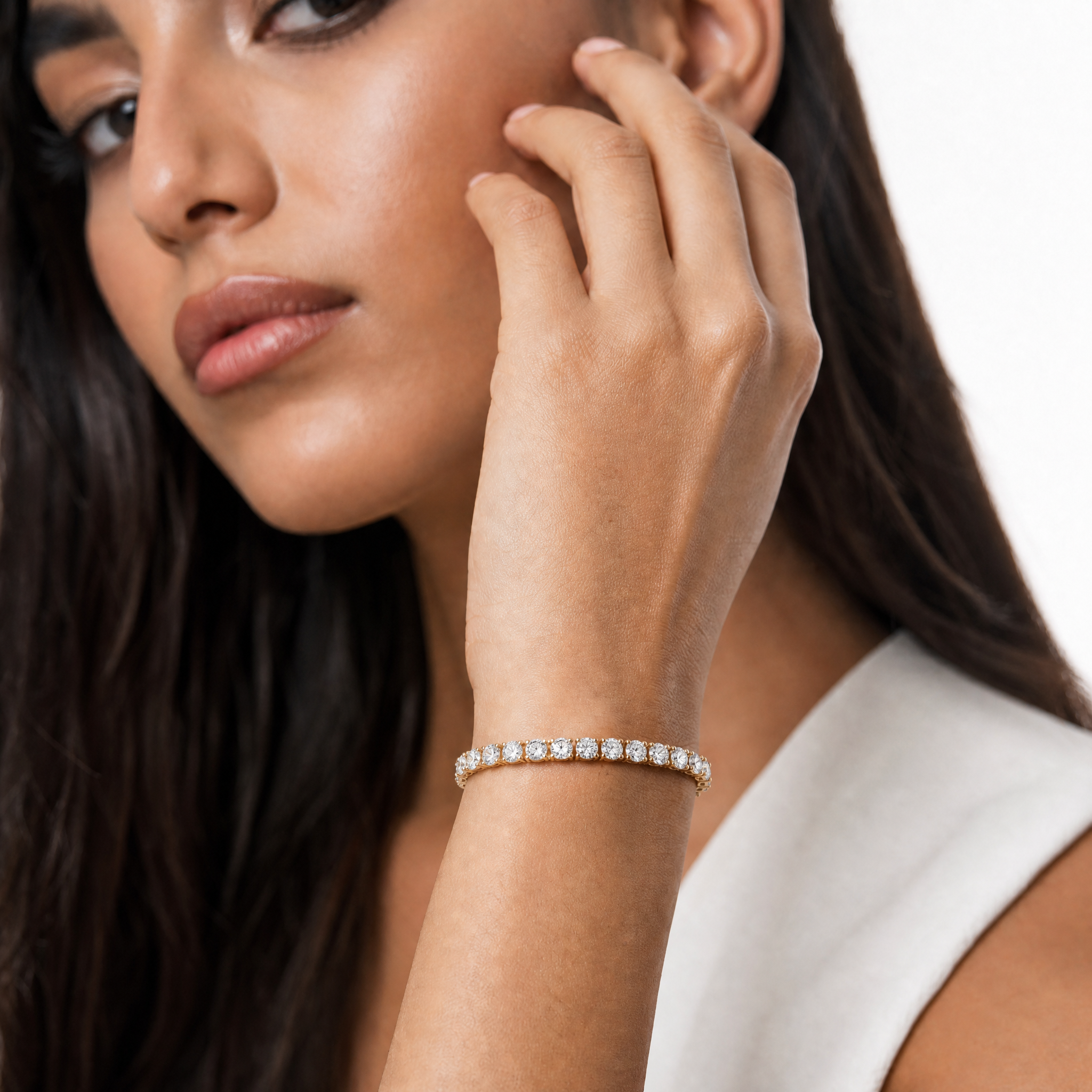 Elegant female model wearing a 7 carat lab grown diamond tennis bracelet by Raul Diamonds, showcasing luxury fine jewelry styling with timeless sophistication and brilliant sparkle.