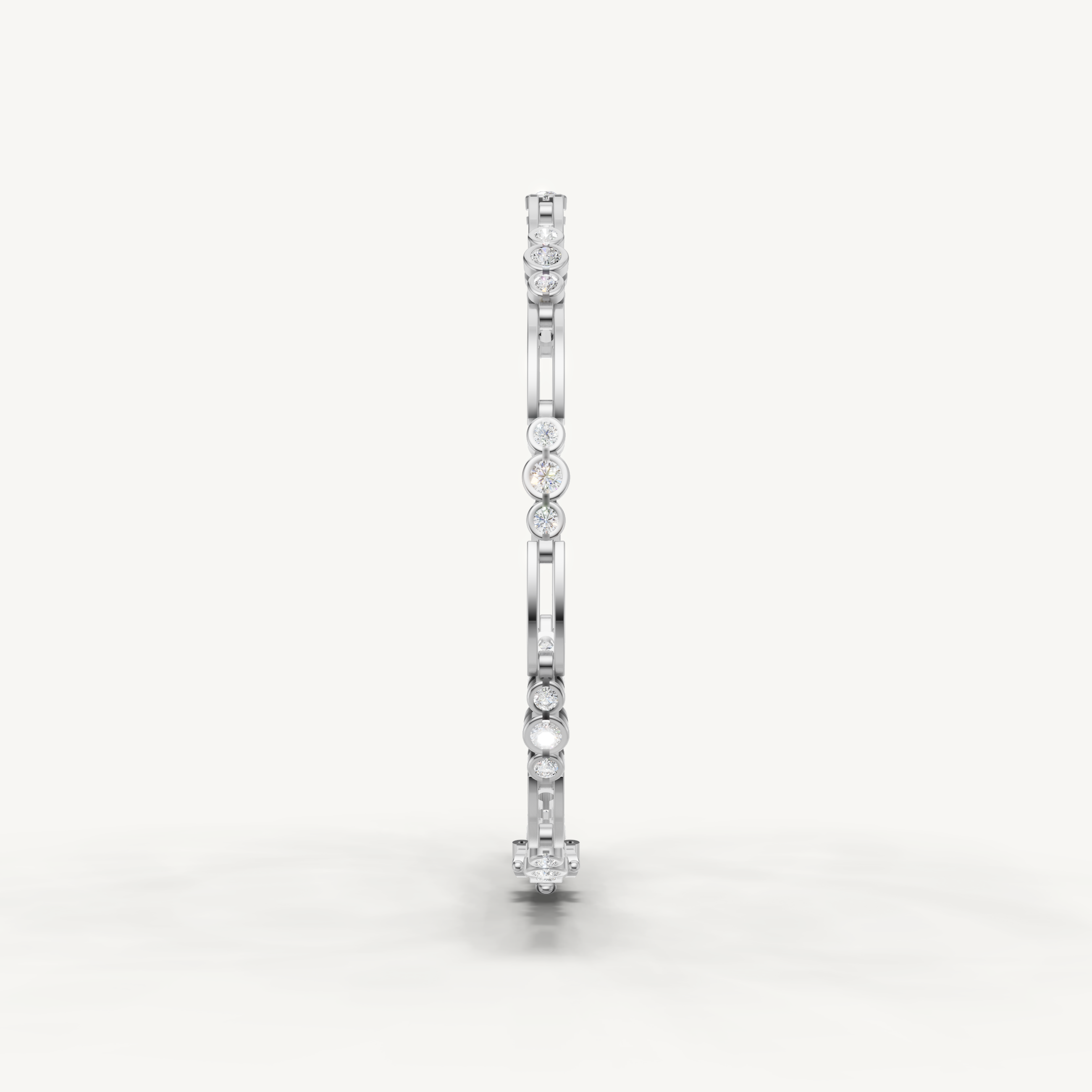 Elegant white gold diamond bracelet featuring bezel set round diamonds by Raul Diamonds