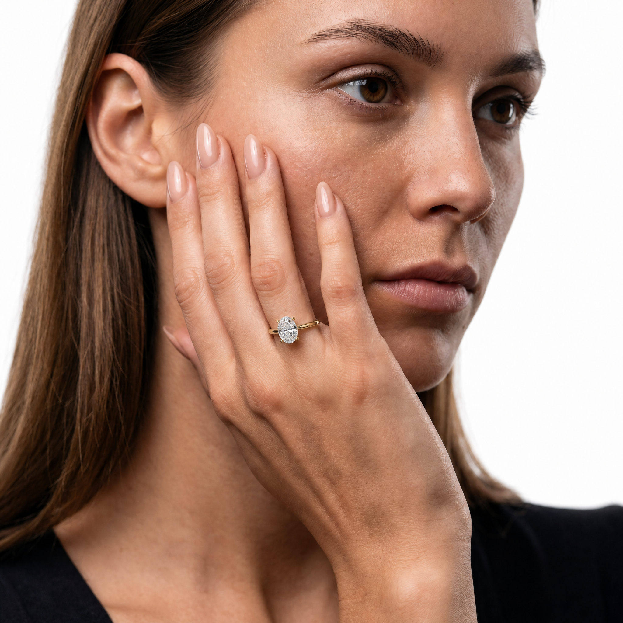 Stunning model displaying the Raul Diamonds Seraphina oval cut diamond engagement ring in 18k yellow gold