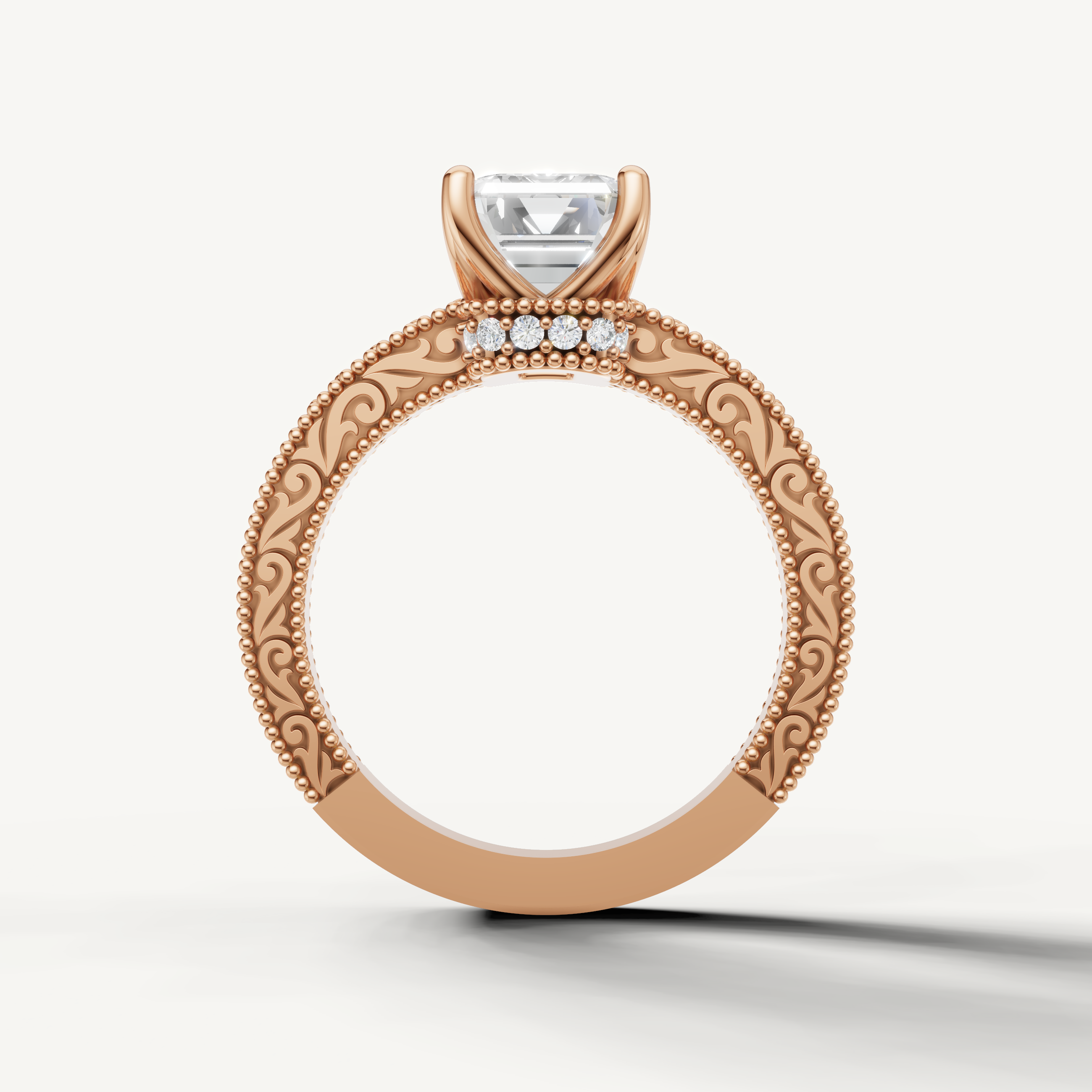 Emerald cut lab grown diamond engagement ring in rose gold with elegant antique-inspired detailing by Raul Diamonds.