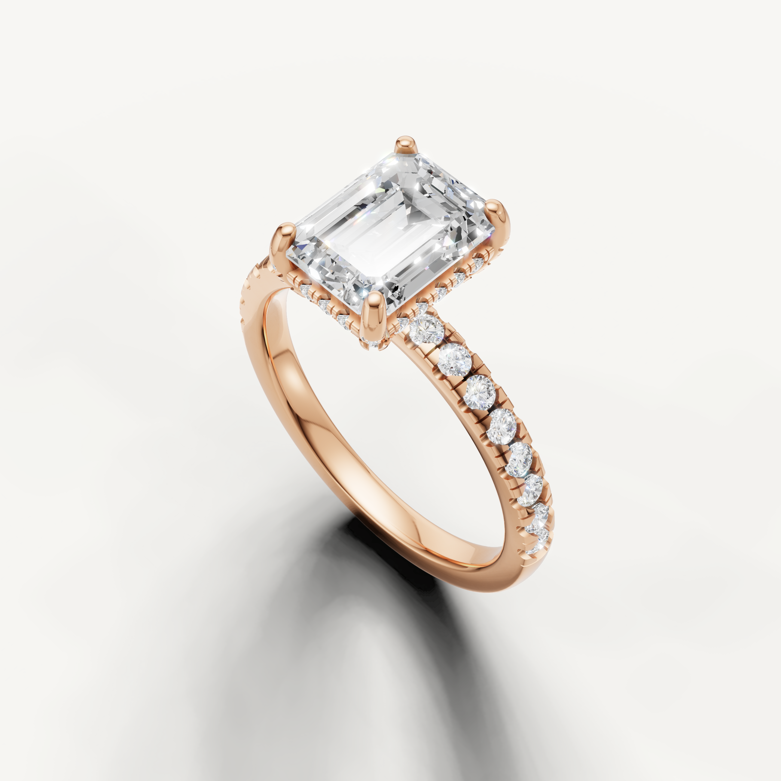 Emerald cut solitaire diamond ring with pavé band rose gold elegant design