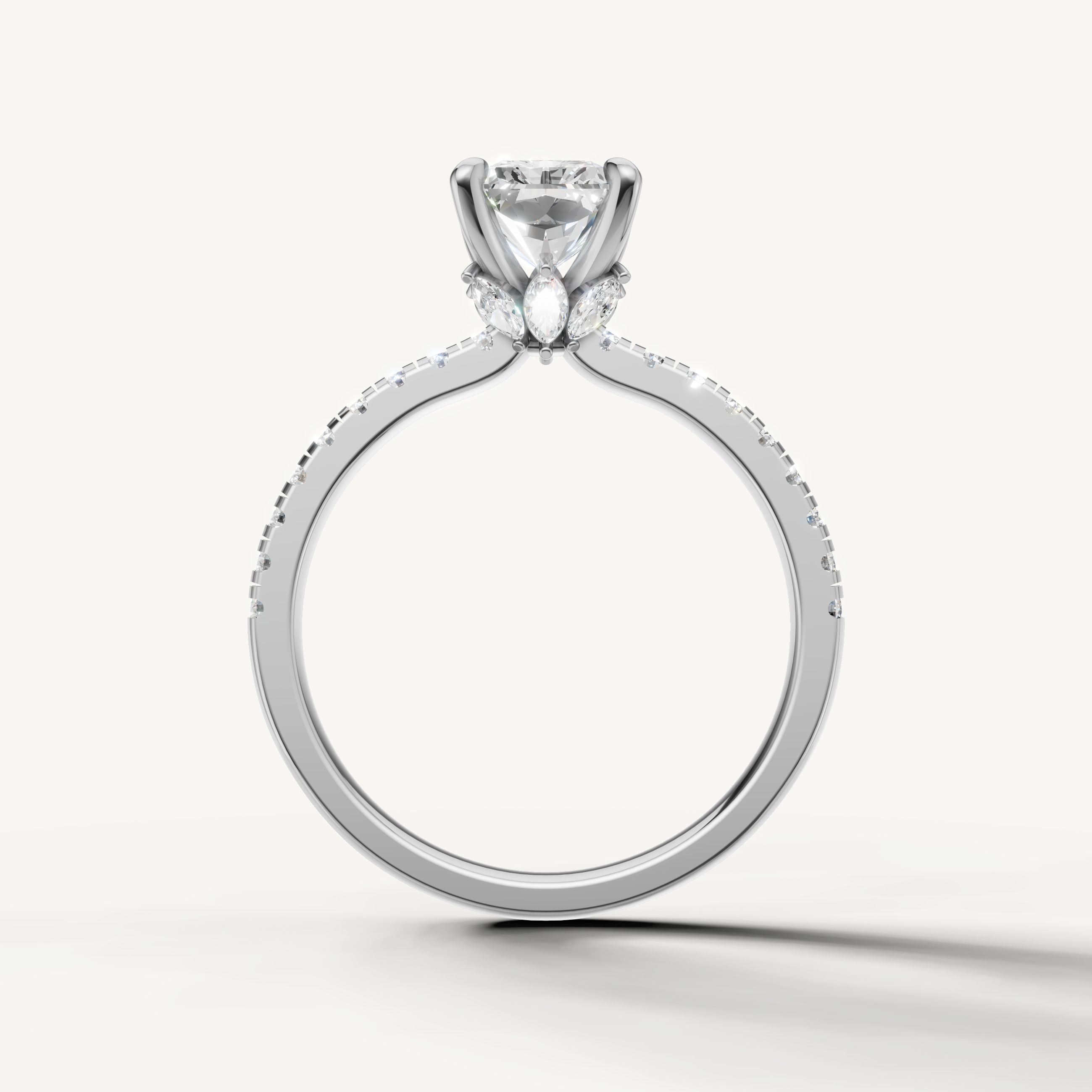 Luxury white gold radiant diamond wedding ring showcasing the hallmark rectangular facets and pavé diamond detail.