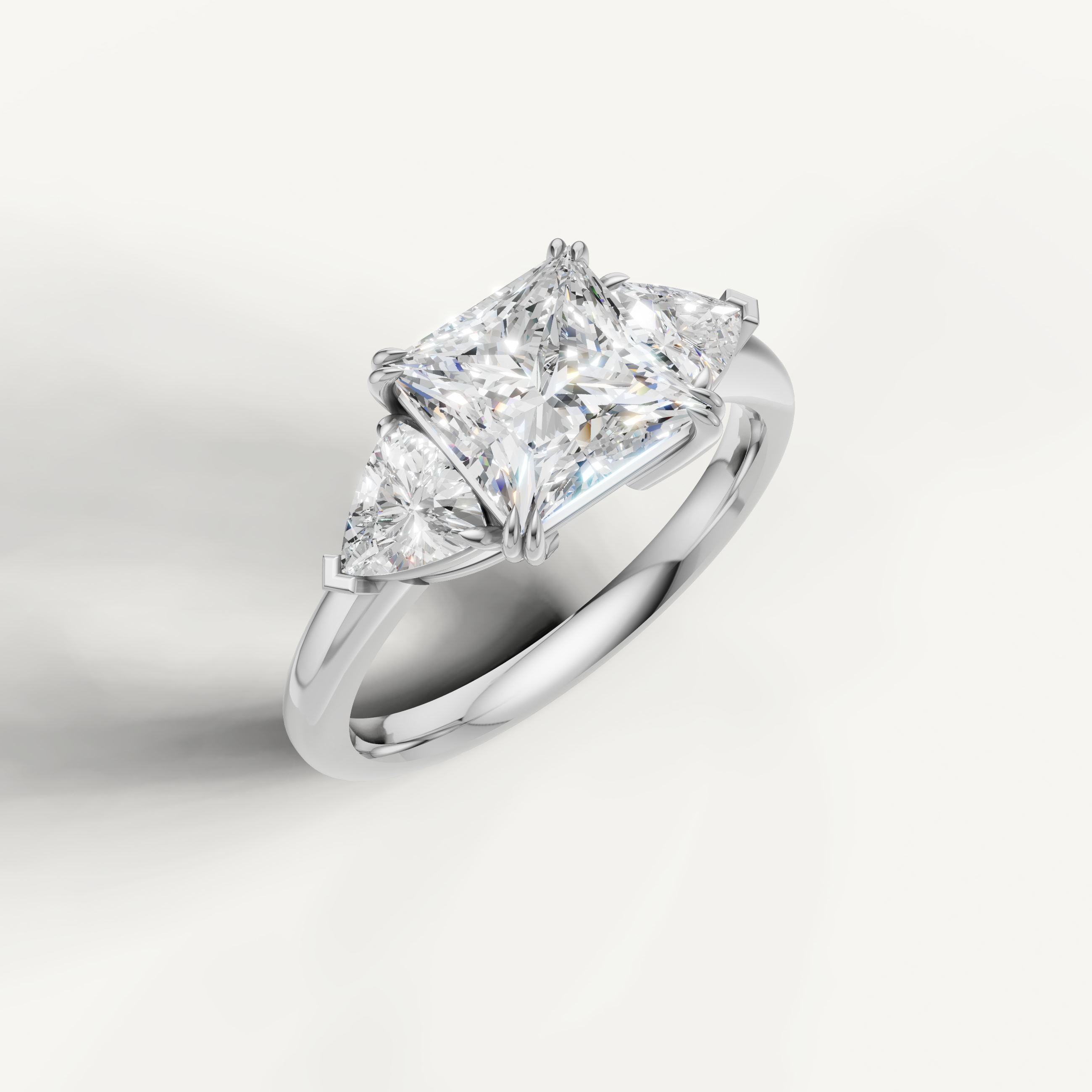 luxurious princess cut lab grown diamond trilogy ring with brilliant trillion side accents