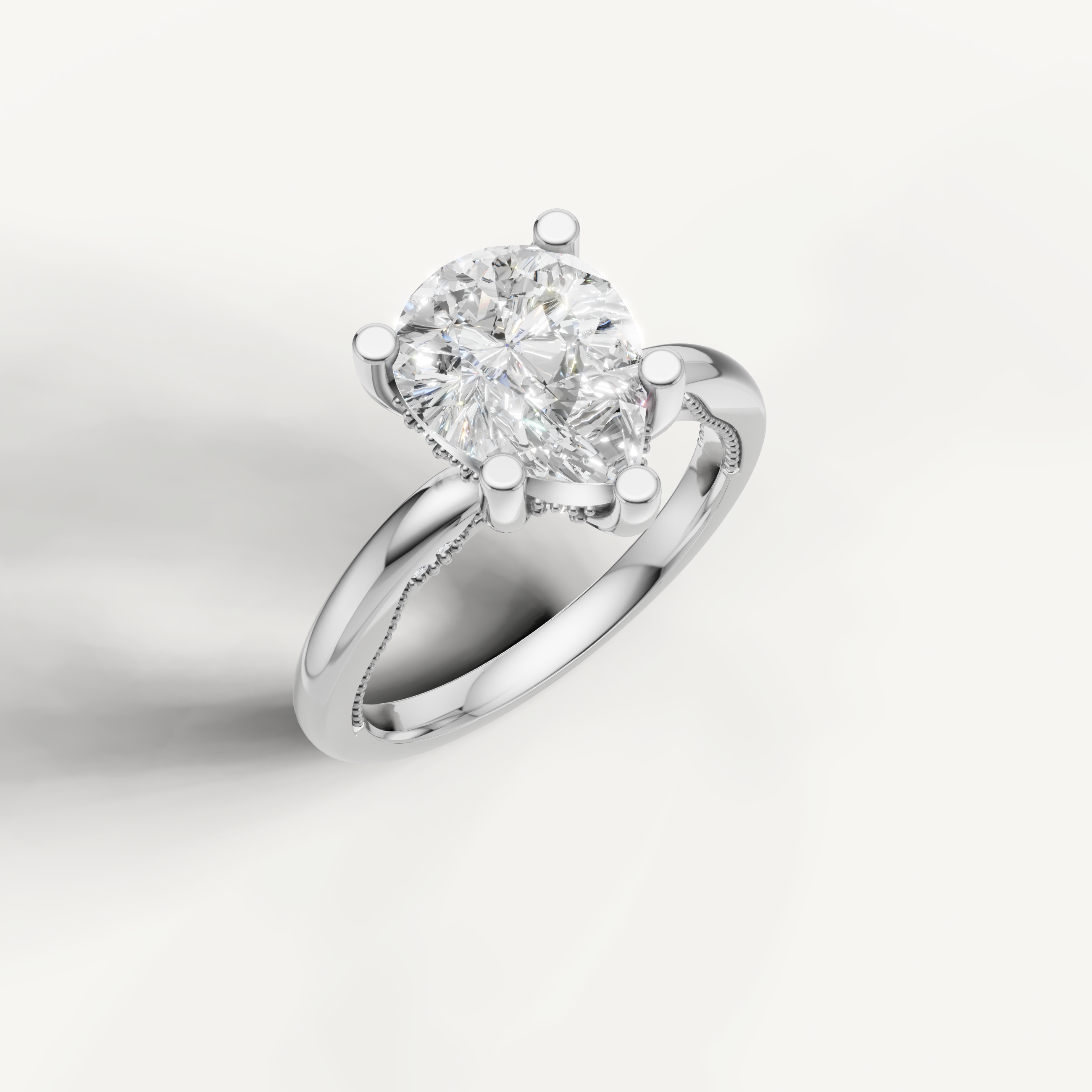 A sleek, silvery-white band holding a prominent pear-cut center stone, designed for a clean and elegant look.
