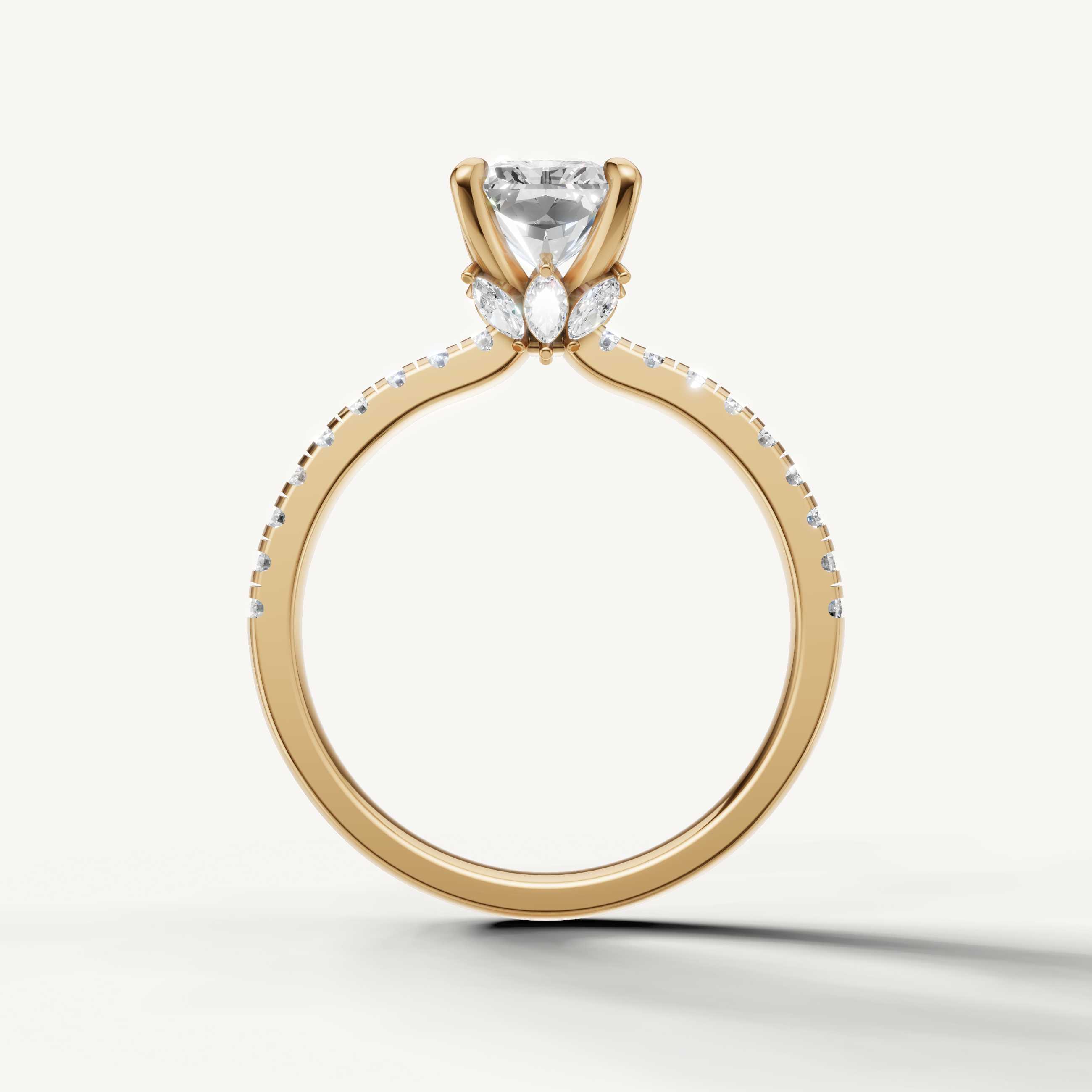 Handcrafted radiant diamond ring in yellow gold by Raul Diamonds, highlighting the elongated shape and pavé accents.