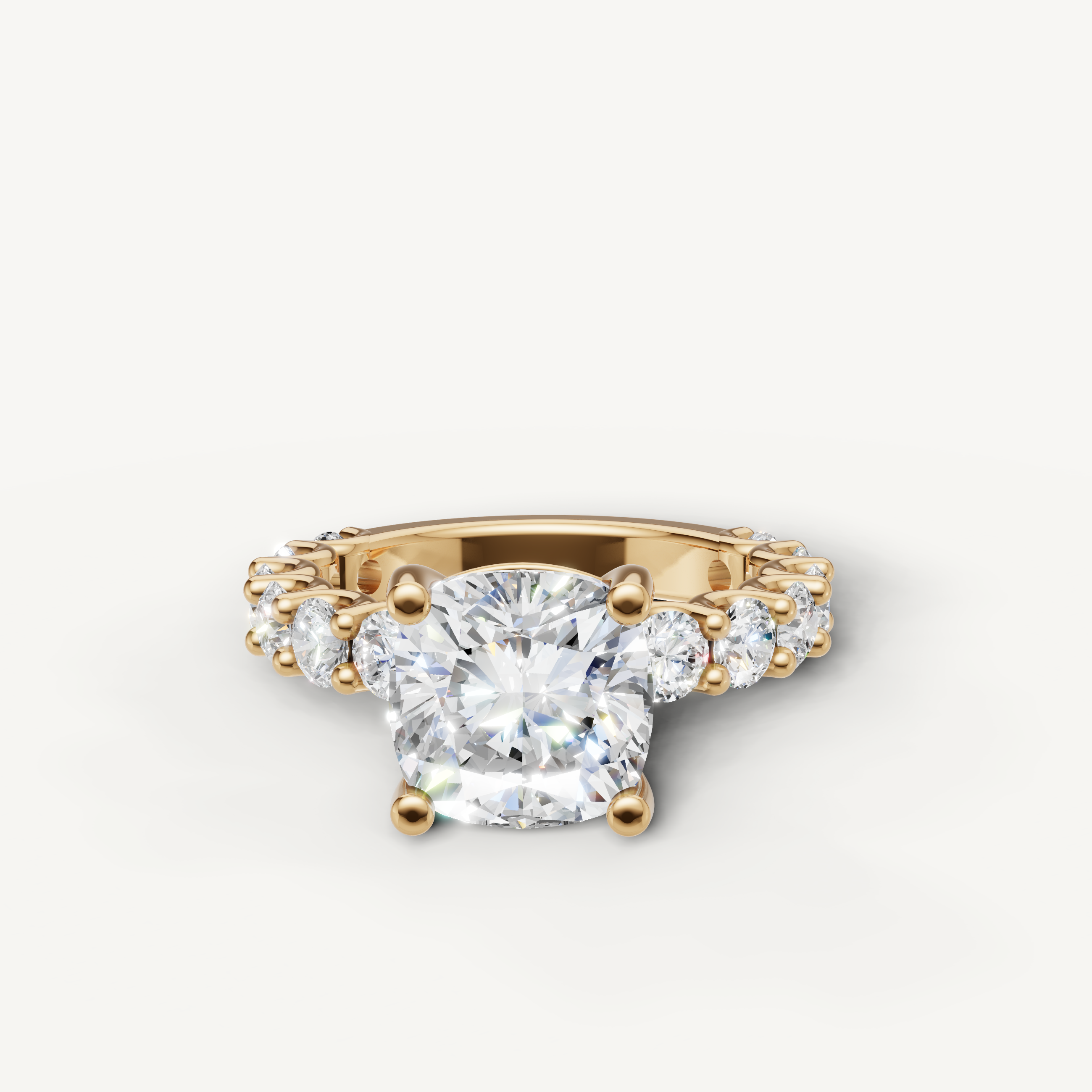 Cushion cut lab grown diamond engagement ring with shared prong band in 14K yellow gold