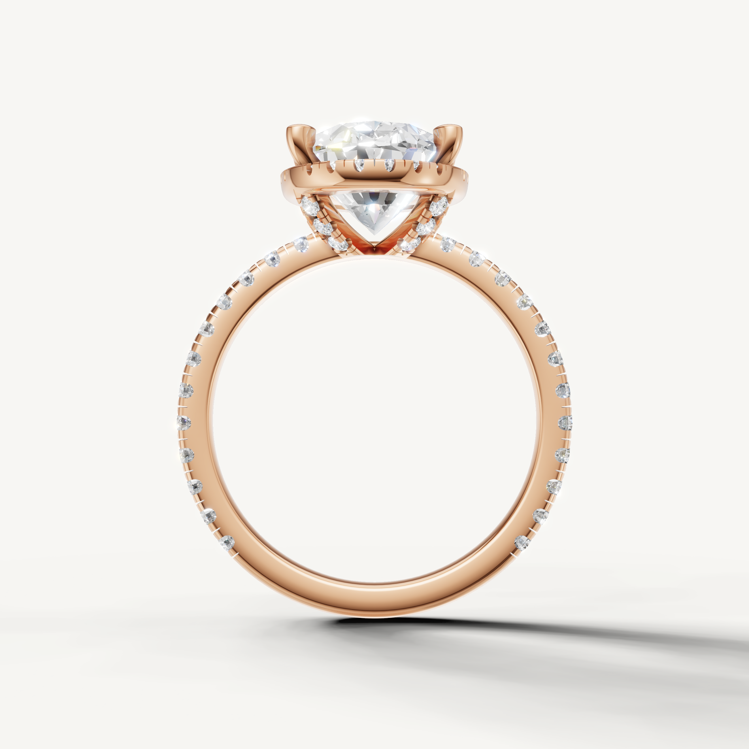 Oval shape engagement ring with pavé band and hidden halo rose gold romantic style