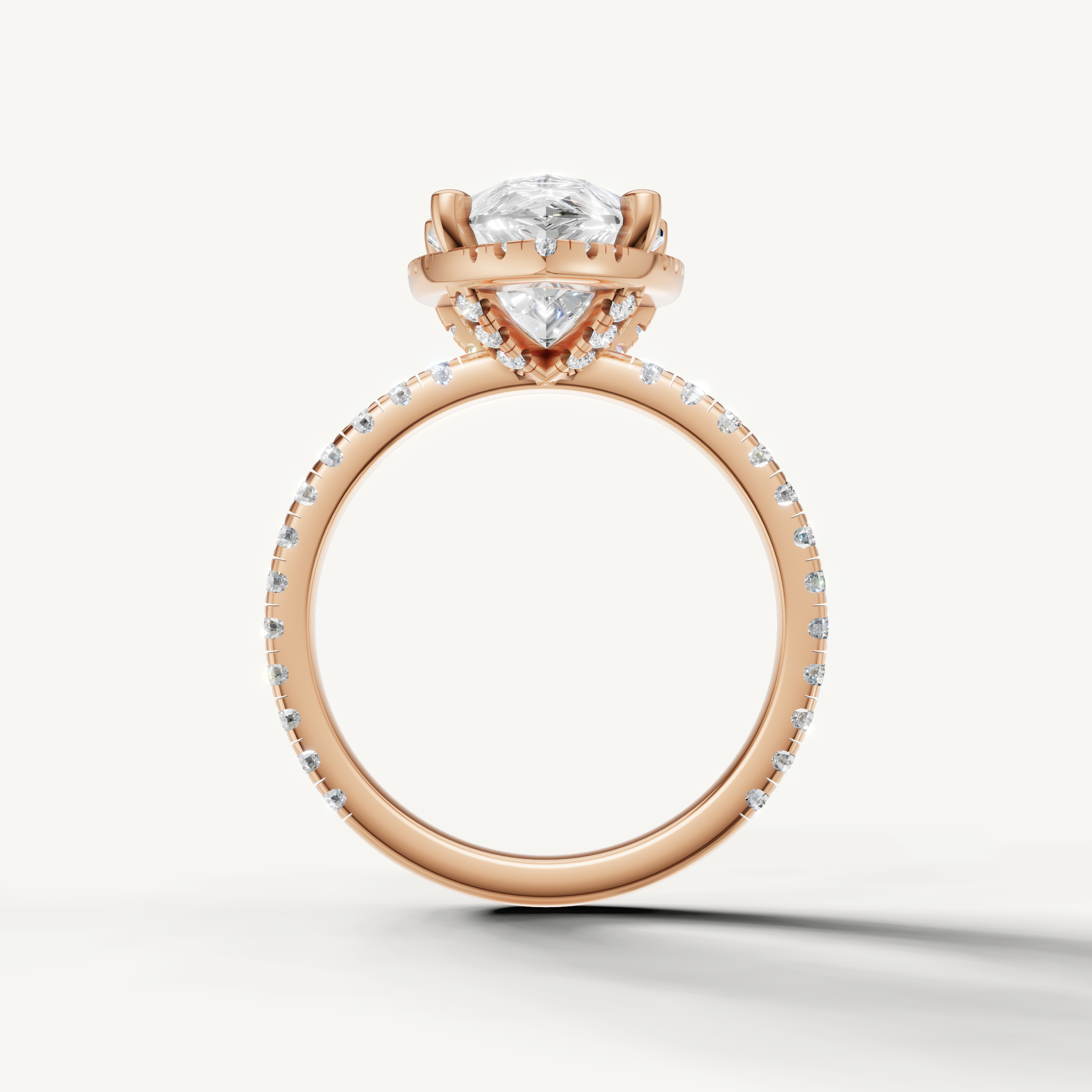 Pear shaped diamond ring with pavé band and hidden halo rose gold romantic design