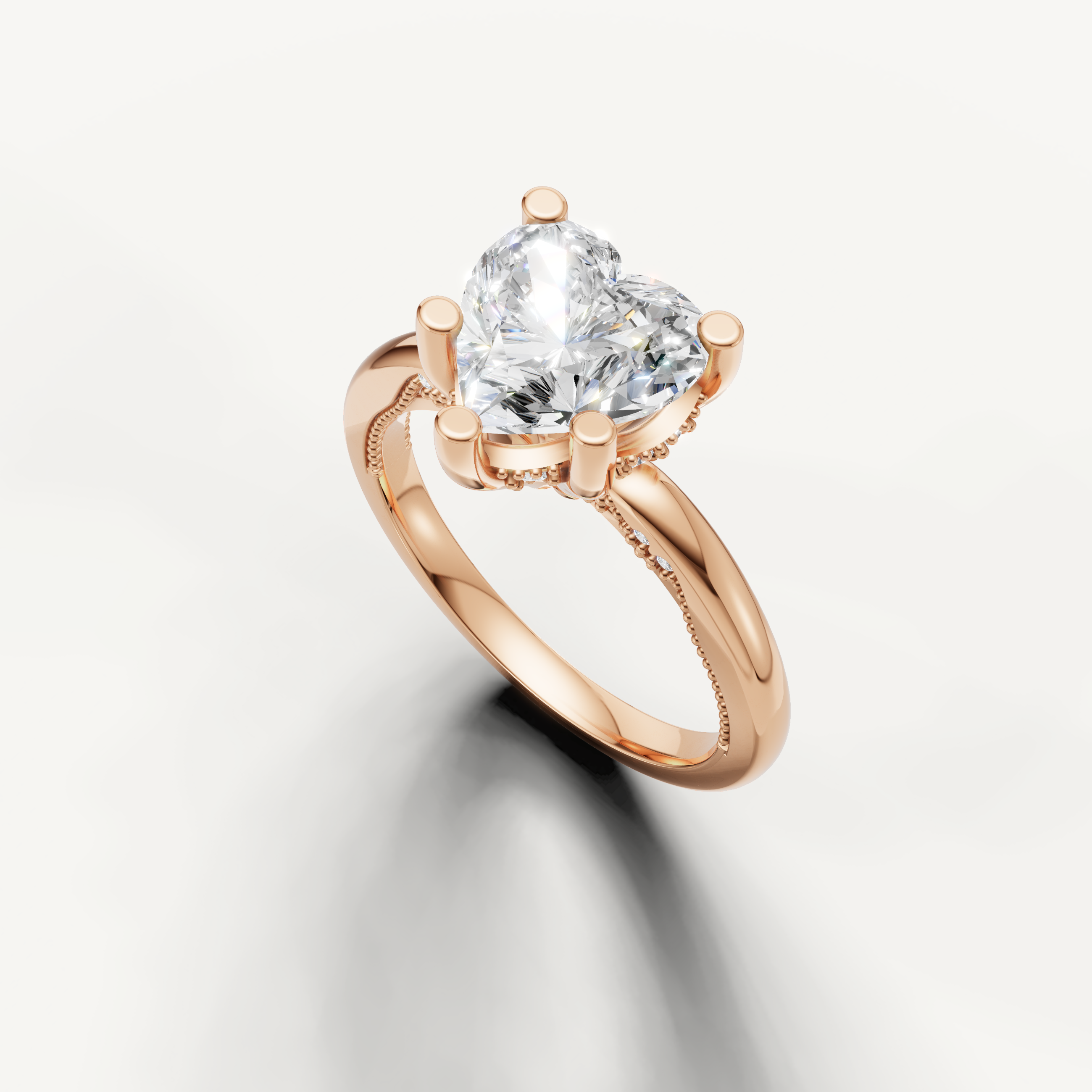A smooth, minimalist rose gold band set with a brilliant heart-shaped diamond, offering a warm and distinctive aesthetic.