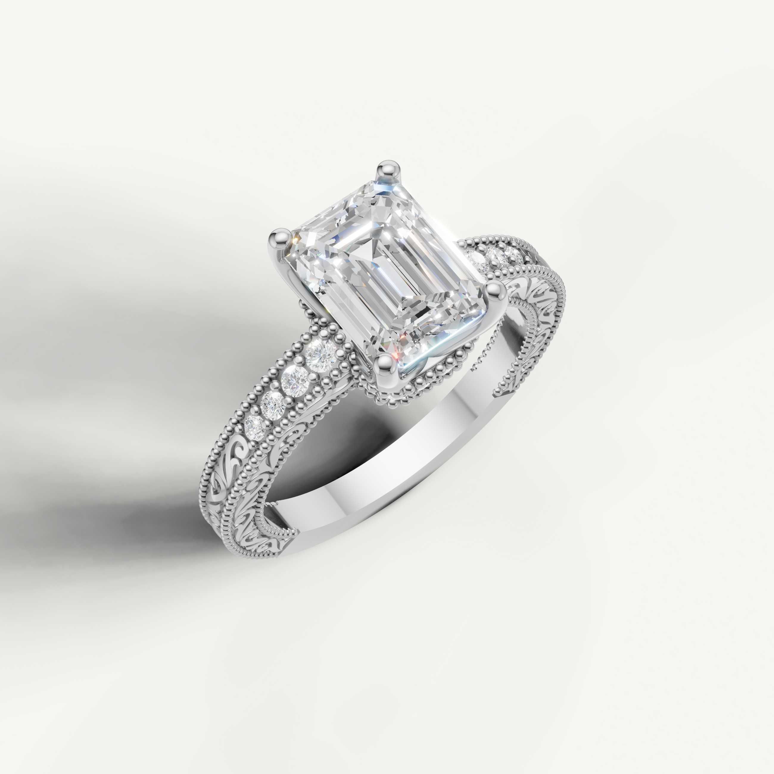 White gold emerald cut lab grown diamond ring featuring antique-style scrollwork and milgrain craftsmanship by Raul Diamonds.