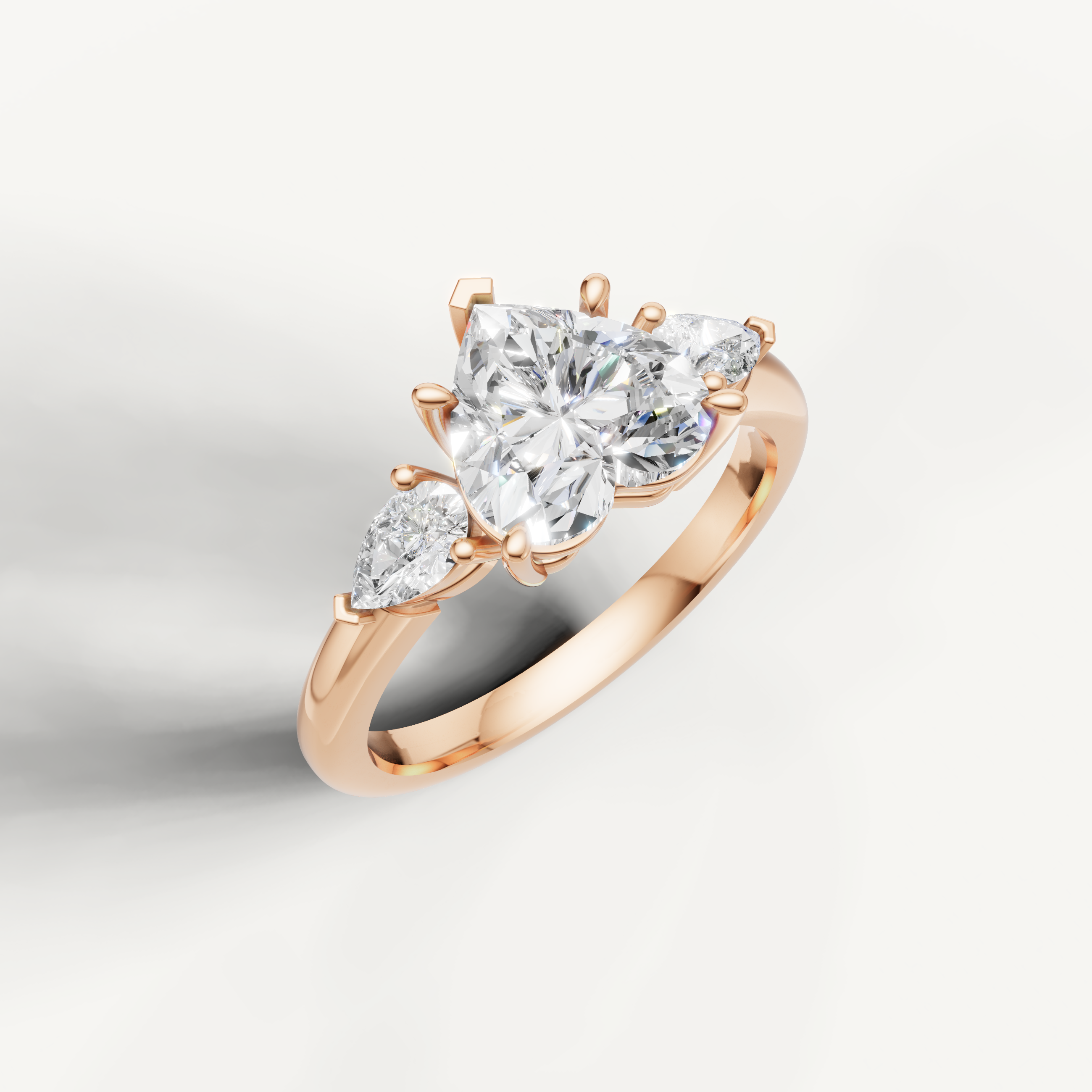 IGI certified heart shape lab diamond three stone ring with pear sides 14k rose gold