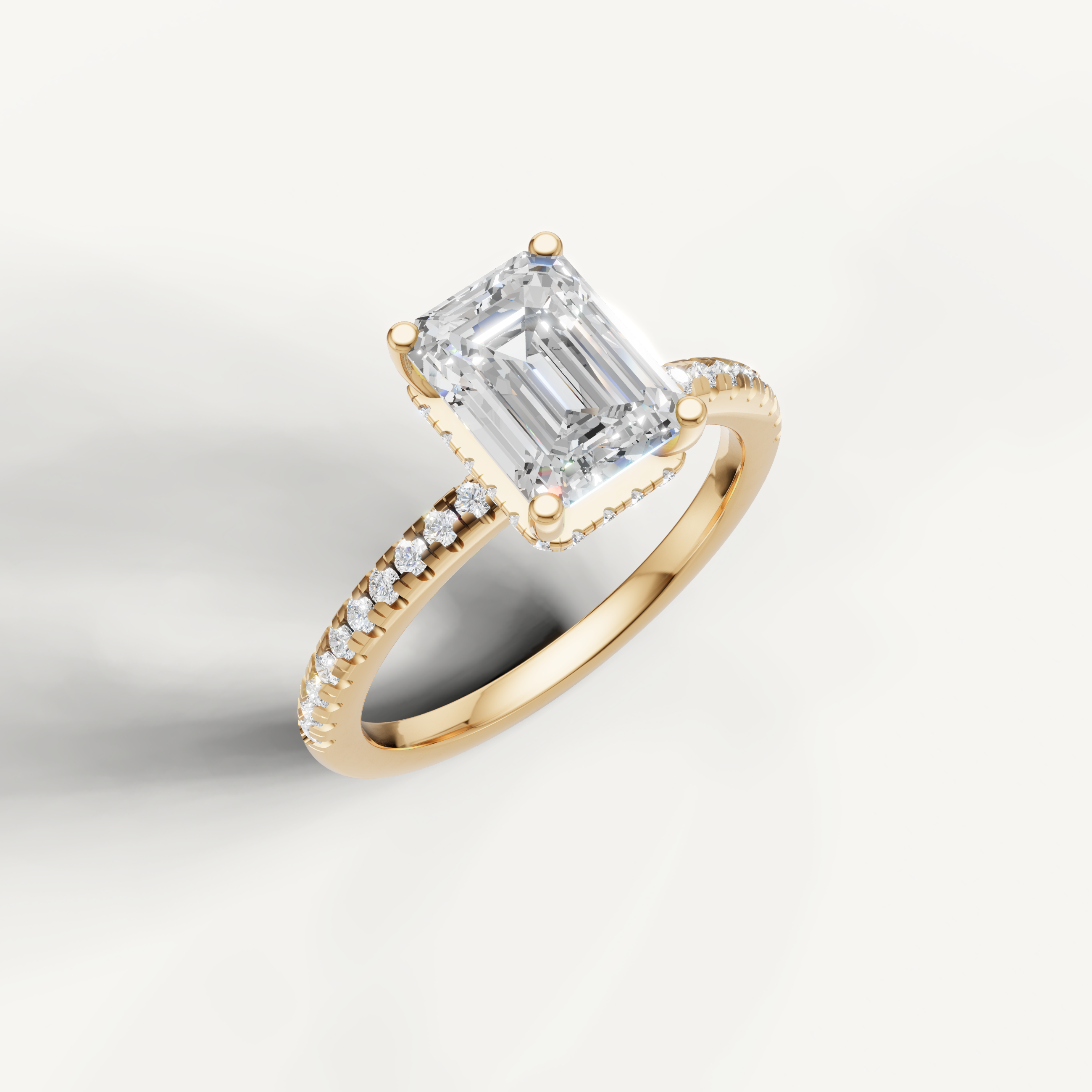 IGI certified emerald lab diamond solitaire ring with micro pavé band yellow gold