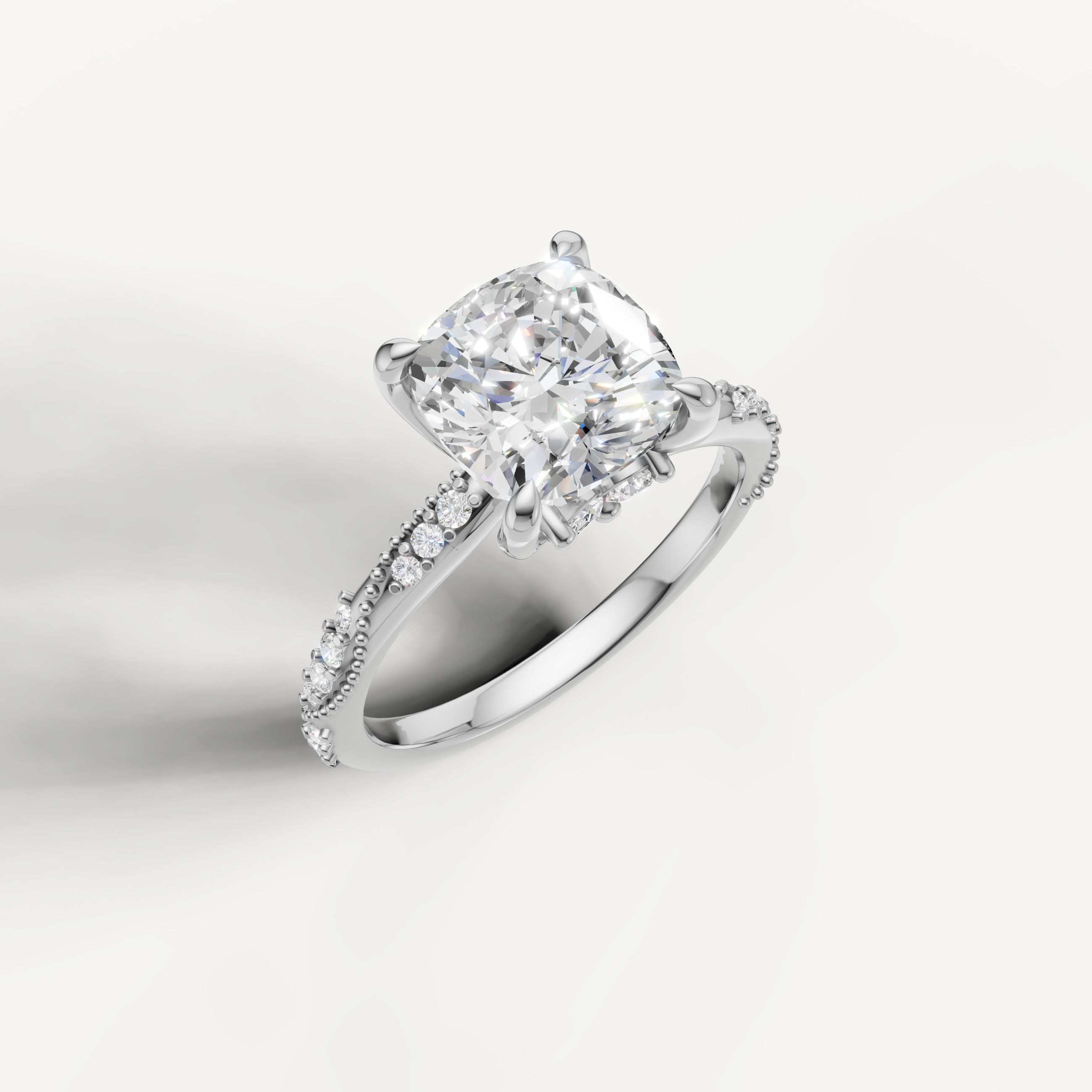 White gold cushion cut lab grown diamond ring with crossover pavé shank and elegant hidden halo styling