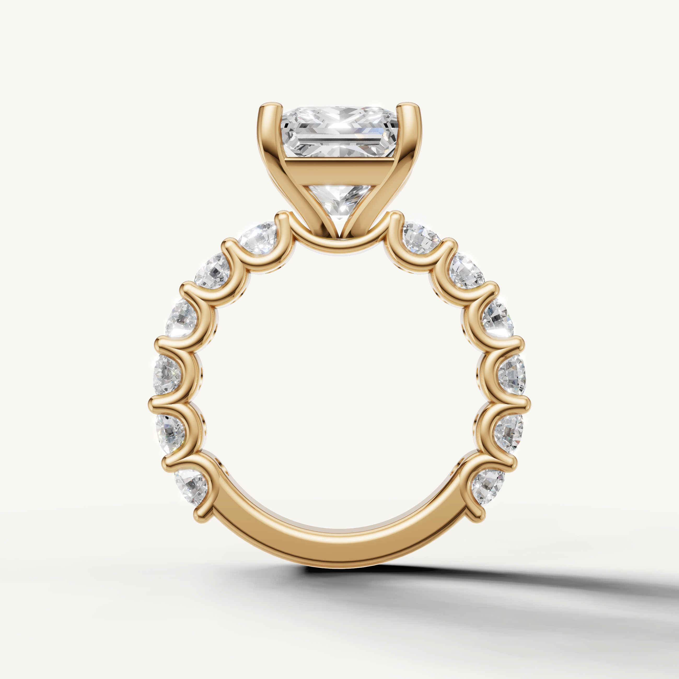 Modern princess engagement ring with open gallery shared prong band yellow gold