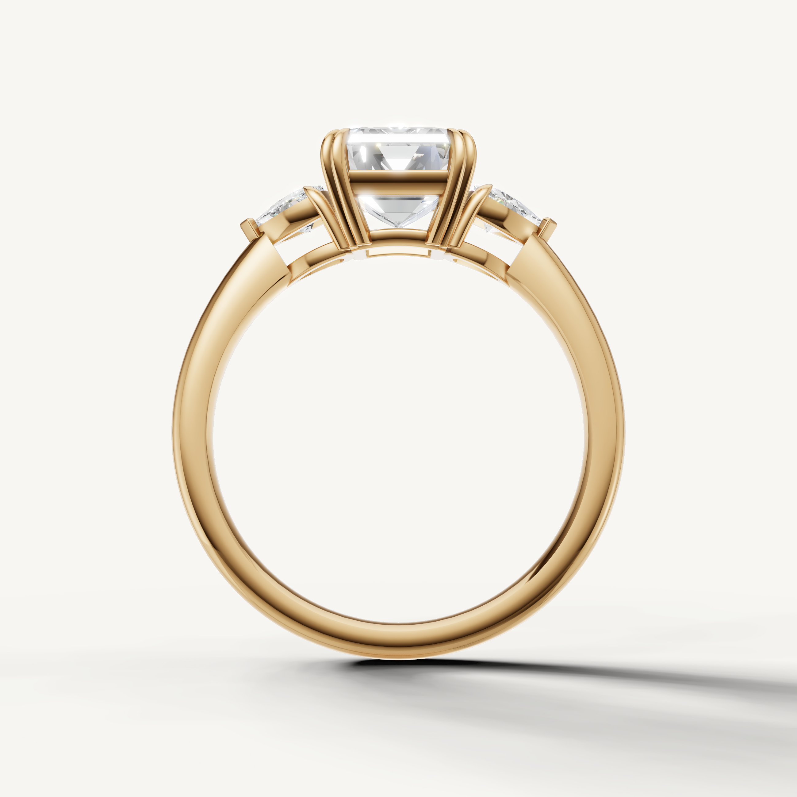 sophisticated emerald cut lab grown diamond engagement ring with pear-inspired trillion side stones