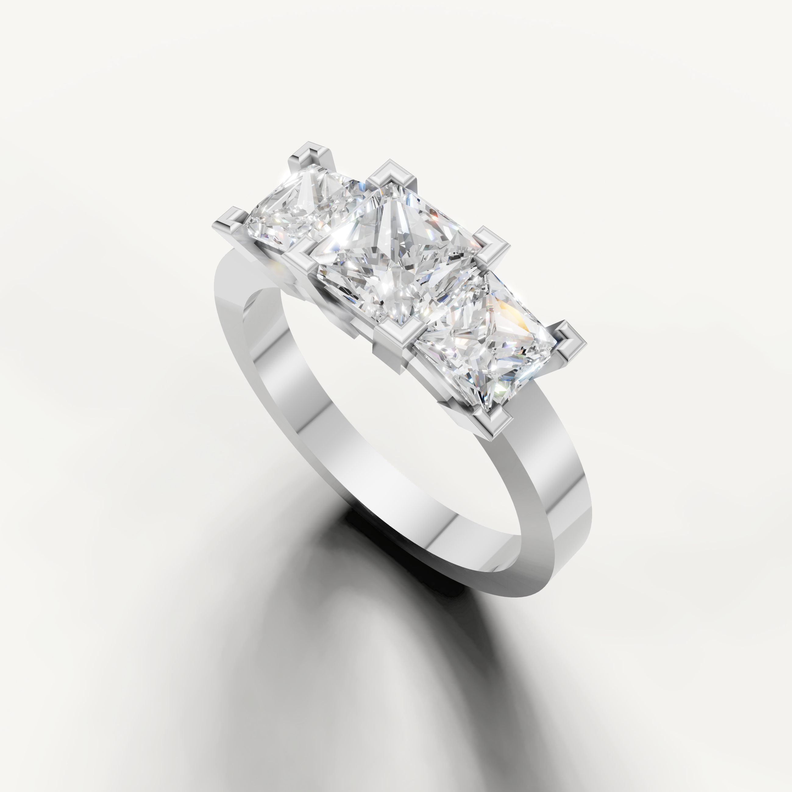 Handcrafted princess three stone engagement ring by Raul Diamonds in luxury gold setting