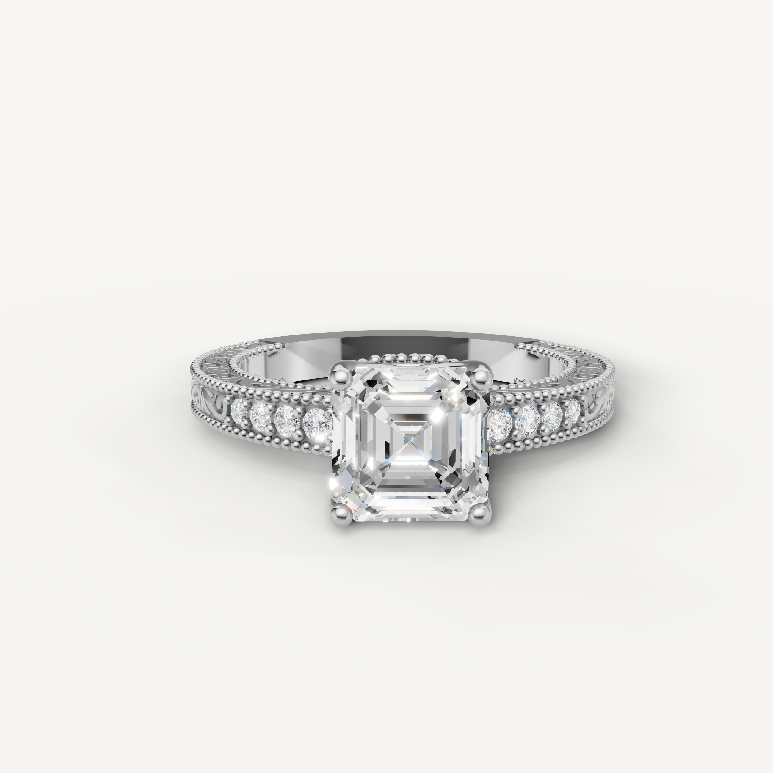 Elegant Asscher diamond engagement ring in white gold with vintage floral engraving and pavé diamonds by Raul Diamonds.