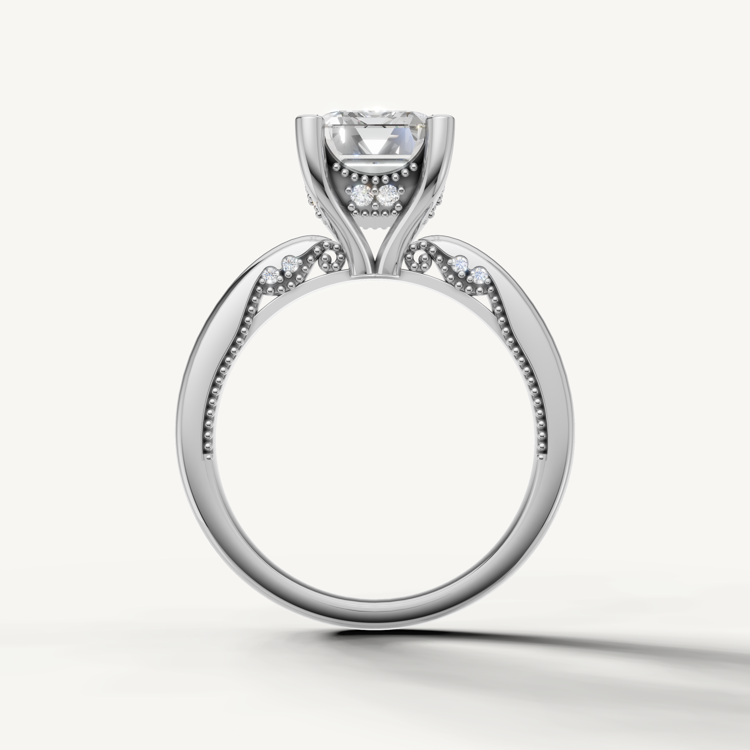 A luxury white gold engagement ring that maximizes the brilliance and step-cut facets of a central emerald-cut diamond.