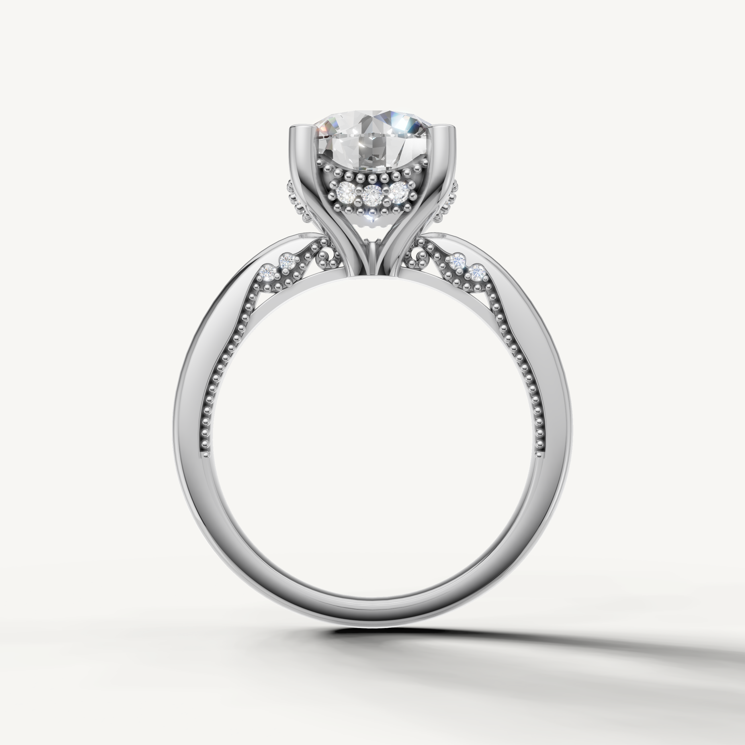 A luxury white gold engagement ring that maximizes the brilliance and fire of a central round-cut diamond against a cool, bright metal finish.