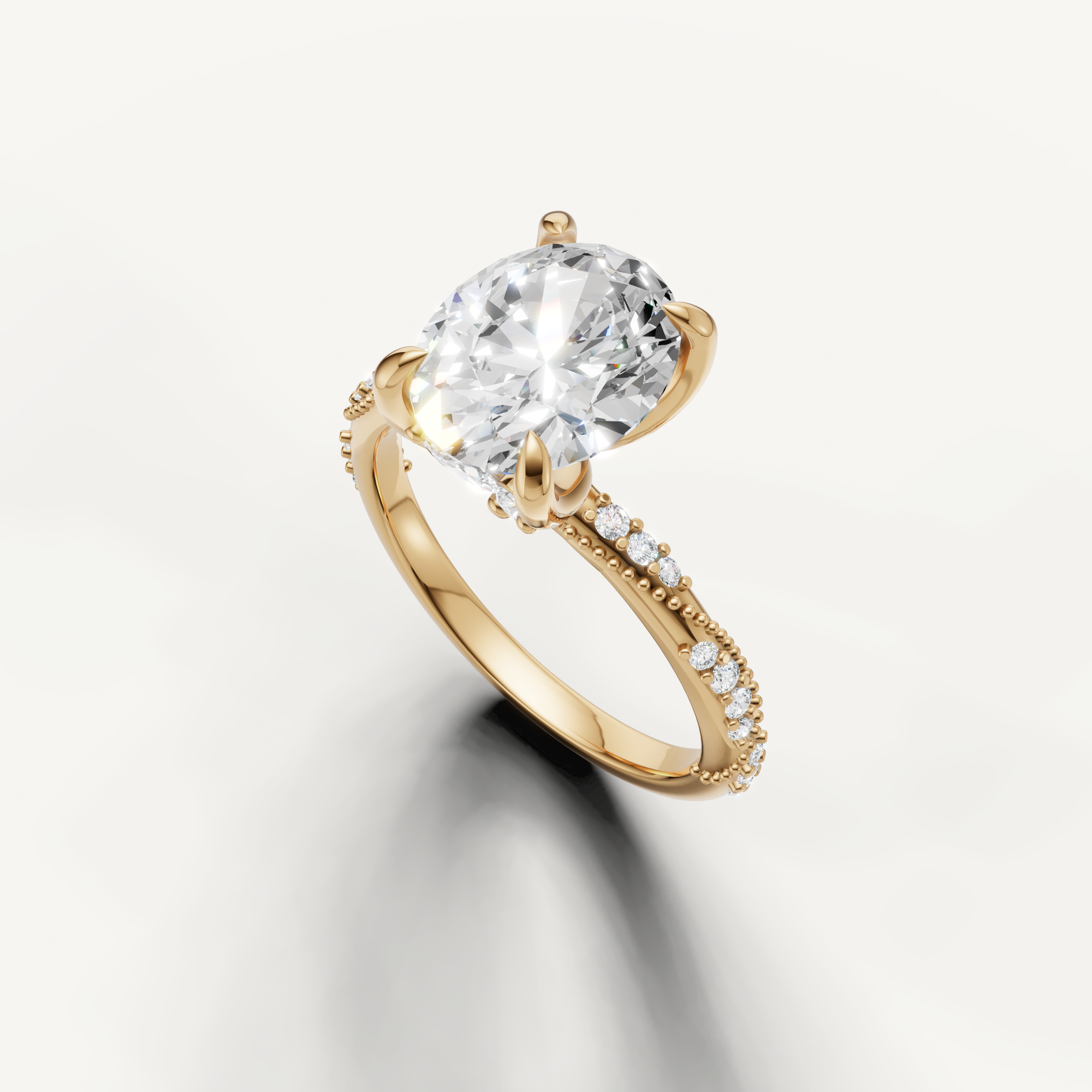oval lab grown diamond ring with delicate twisted pavé setting yellow gold